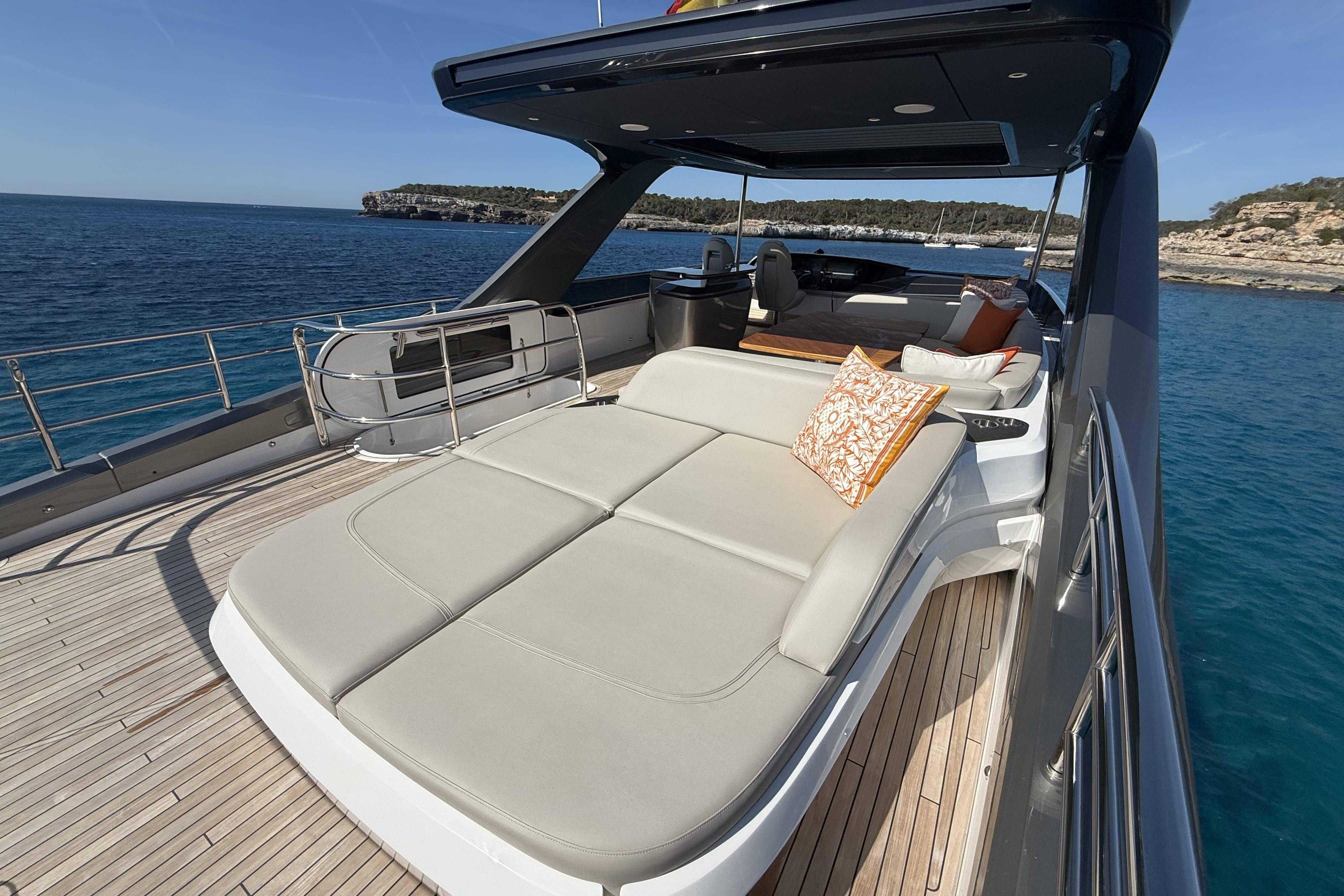Luxurious 2025 Princess Y72 yacht deck with sun loungers and ocean view.