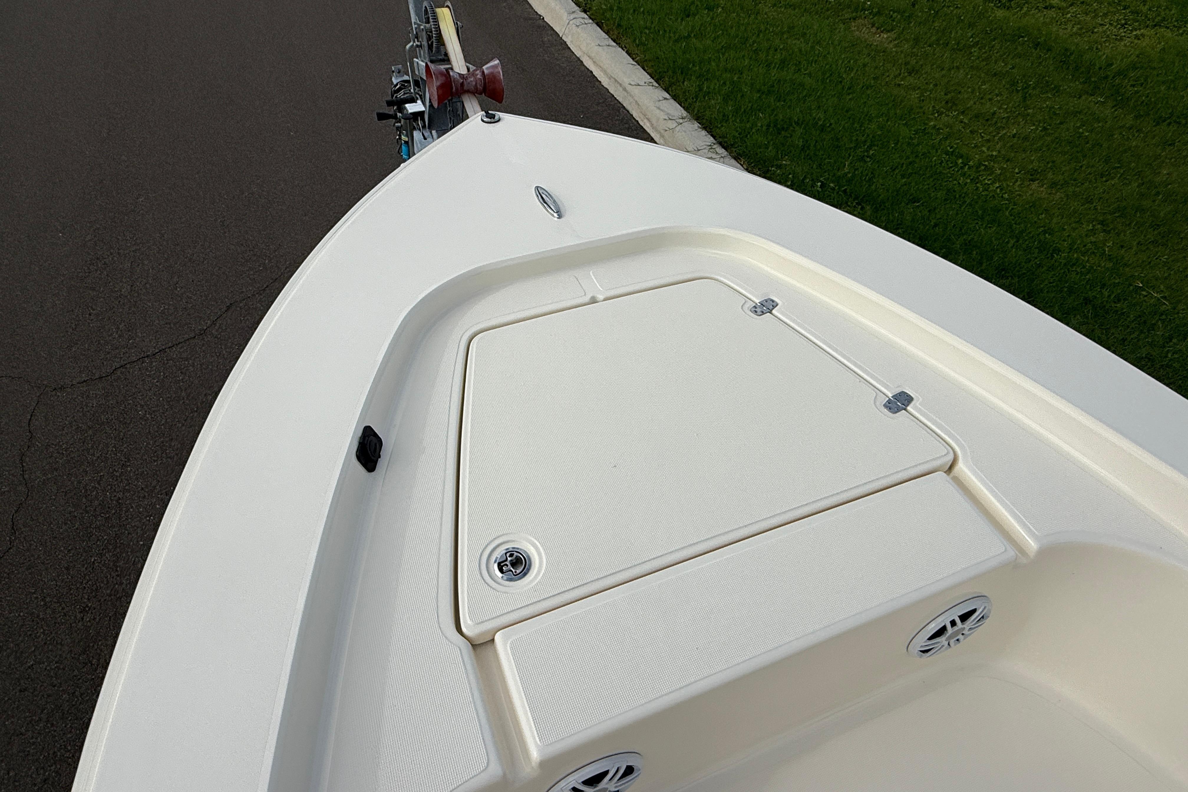 Bow view of 2026 Scout 177 Sport boat, featuring storage compartment and sleek design.