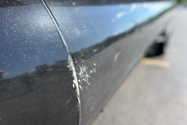 Close-up of a scratched 2025 Regency 250 DL3 boat hull.