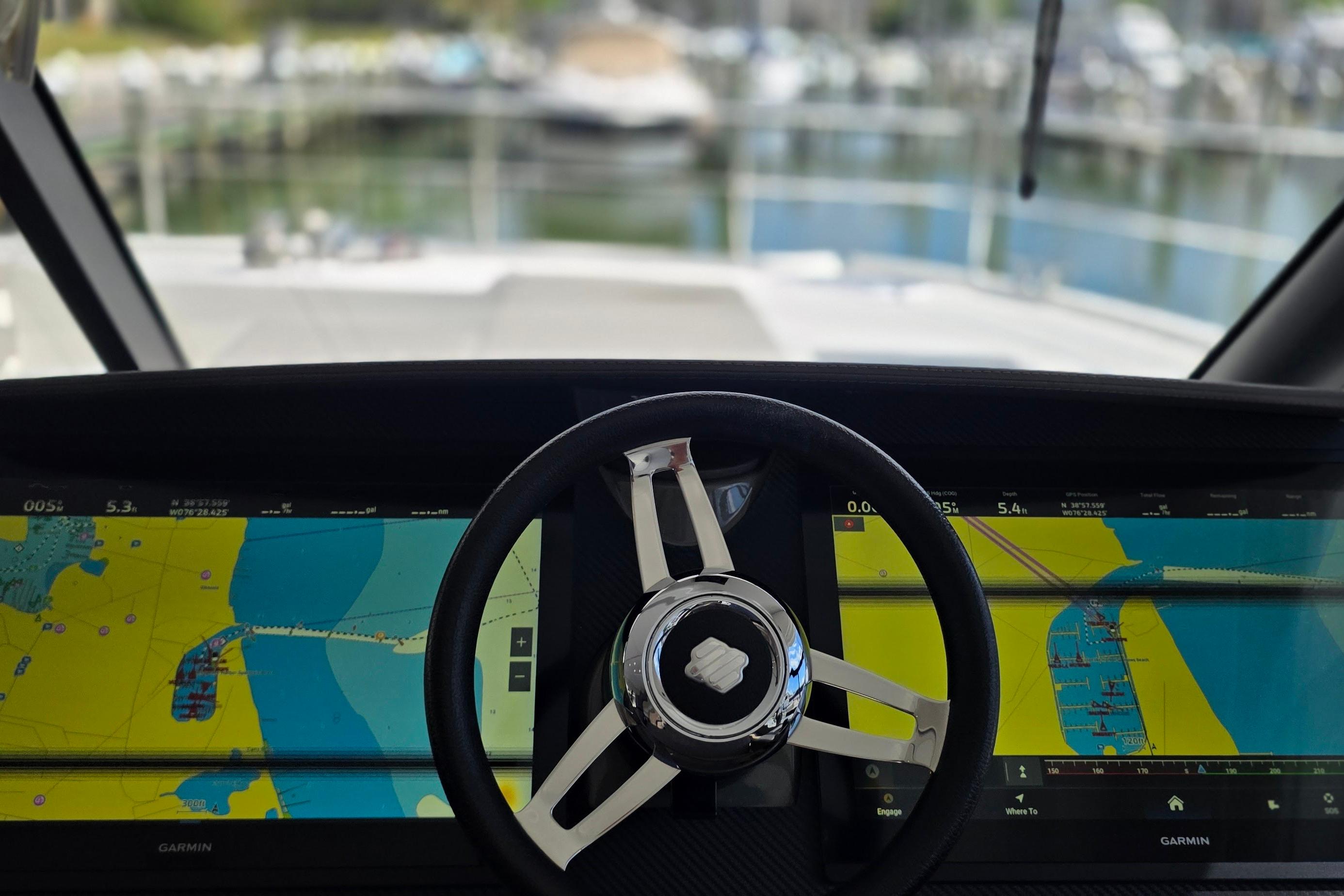 Steering wheel and navigation screens of 2018 Fountaine Pajot Motor Yacht 44.