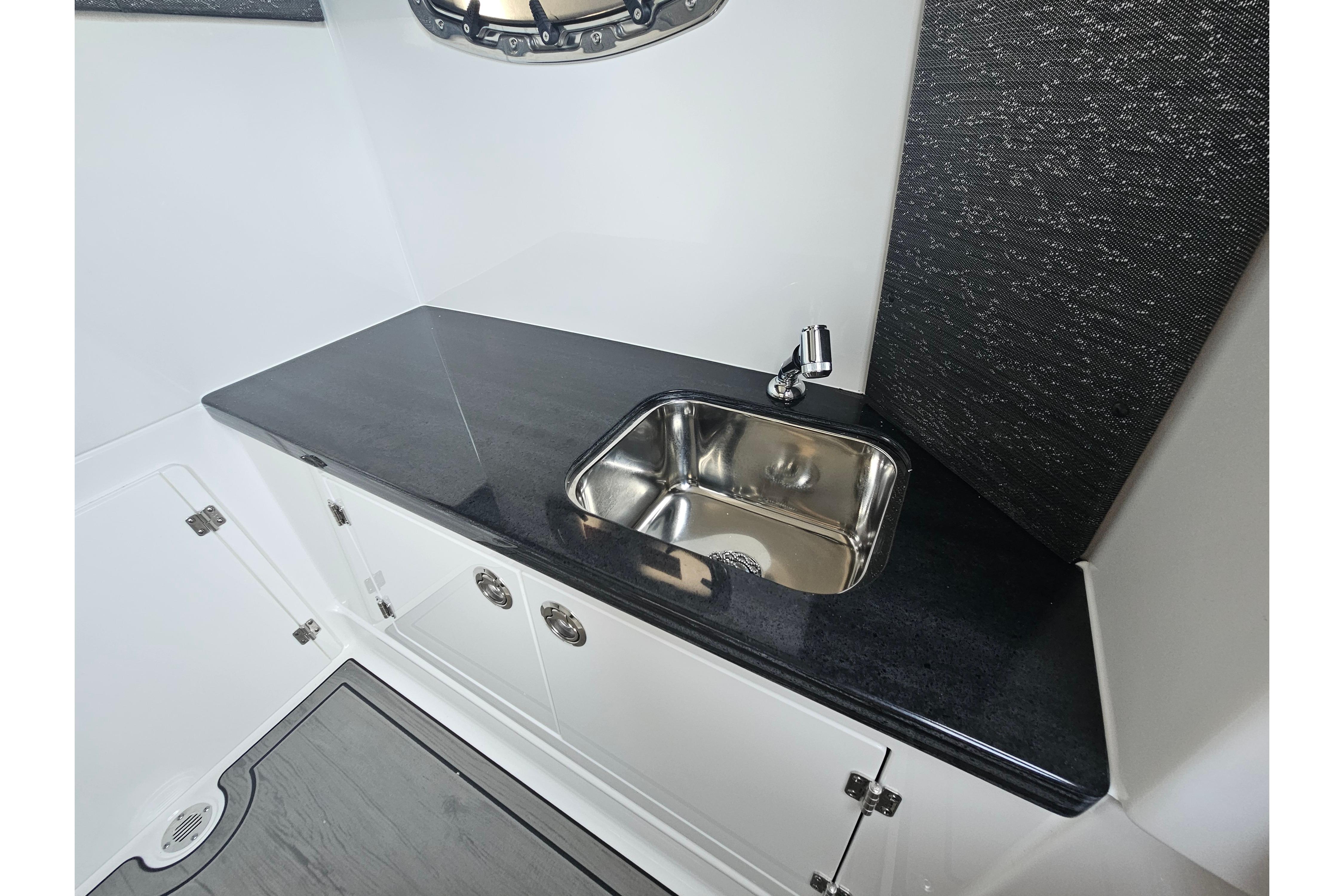 Luxury sink area in 2026 Monterey Elite 27 OB boat interior.