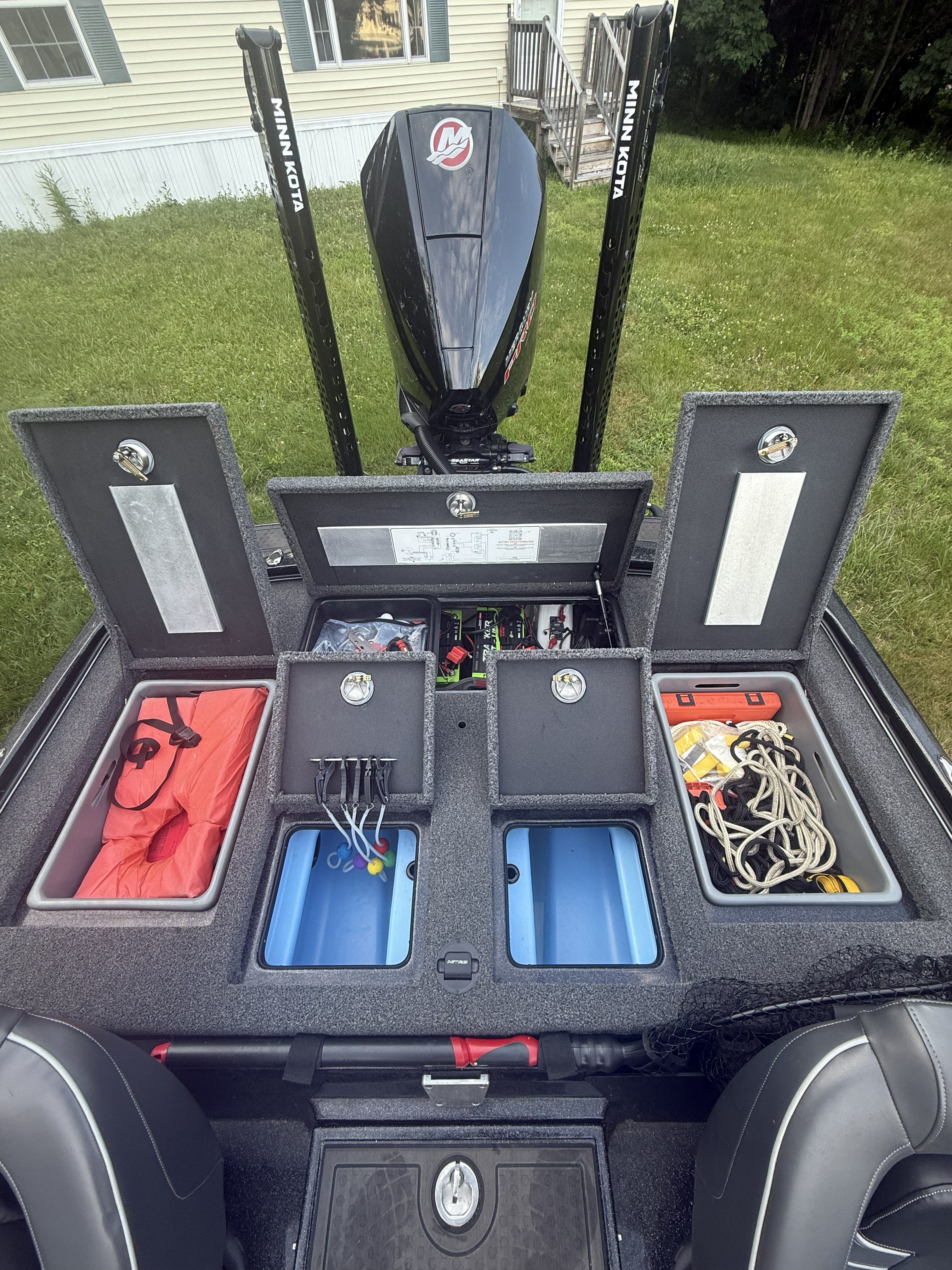 The image shows the rear of a Nitro Z21 XL Pro boat with open storage compartments.