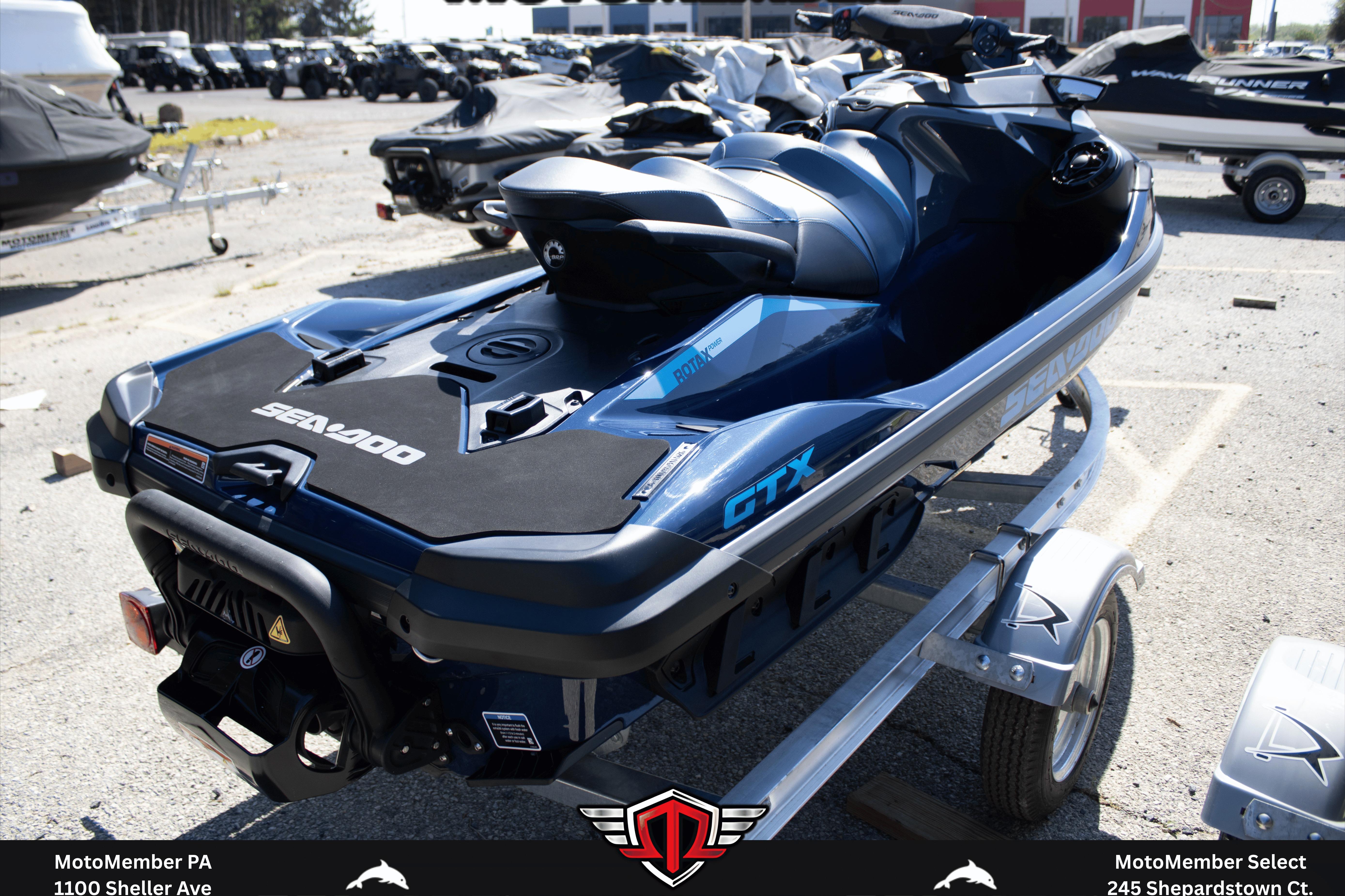 2026 Sea-Doo GTX 230 jet ski on trailer, displayed outdoors in a dealership lot.