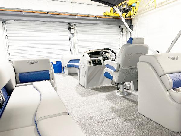 2025 Bennington 23LFBCSR pontoon boat interior with plush seating and modern helm.