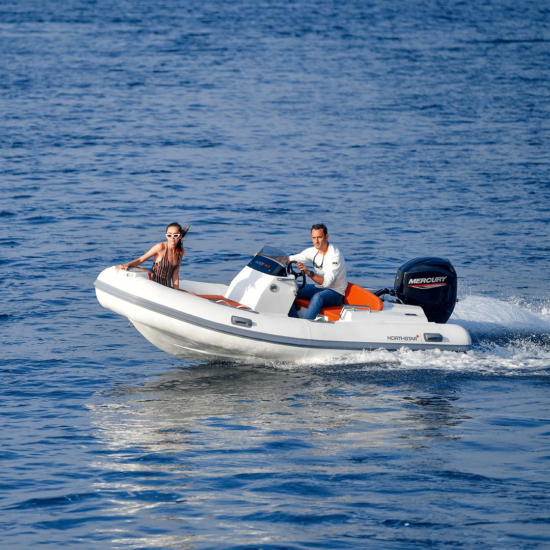 2022 Northstar Axis 4.2 boat cruising on open water with two passengers.