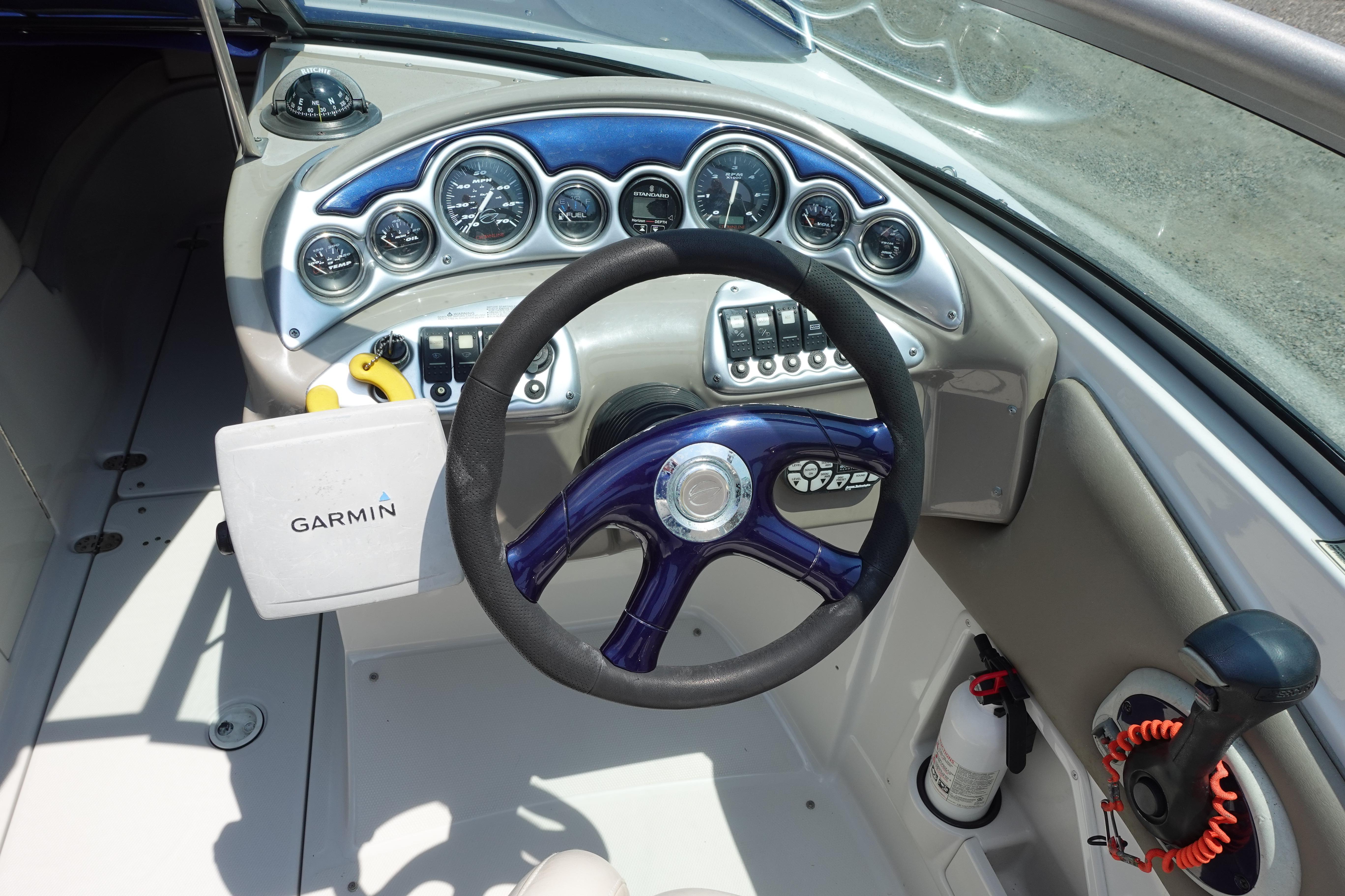 Dashboard of a 2004 Crownline 240 EX boat with Garmin navigation system.