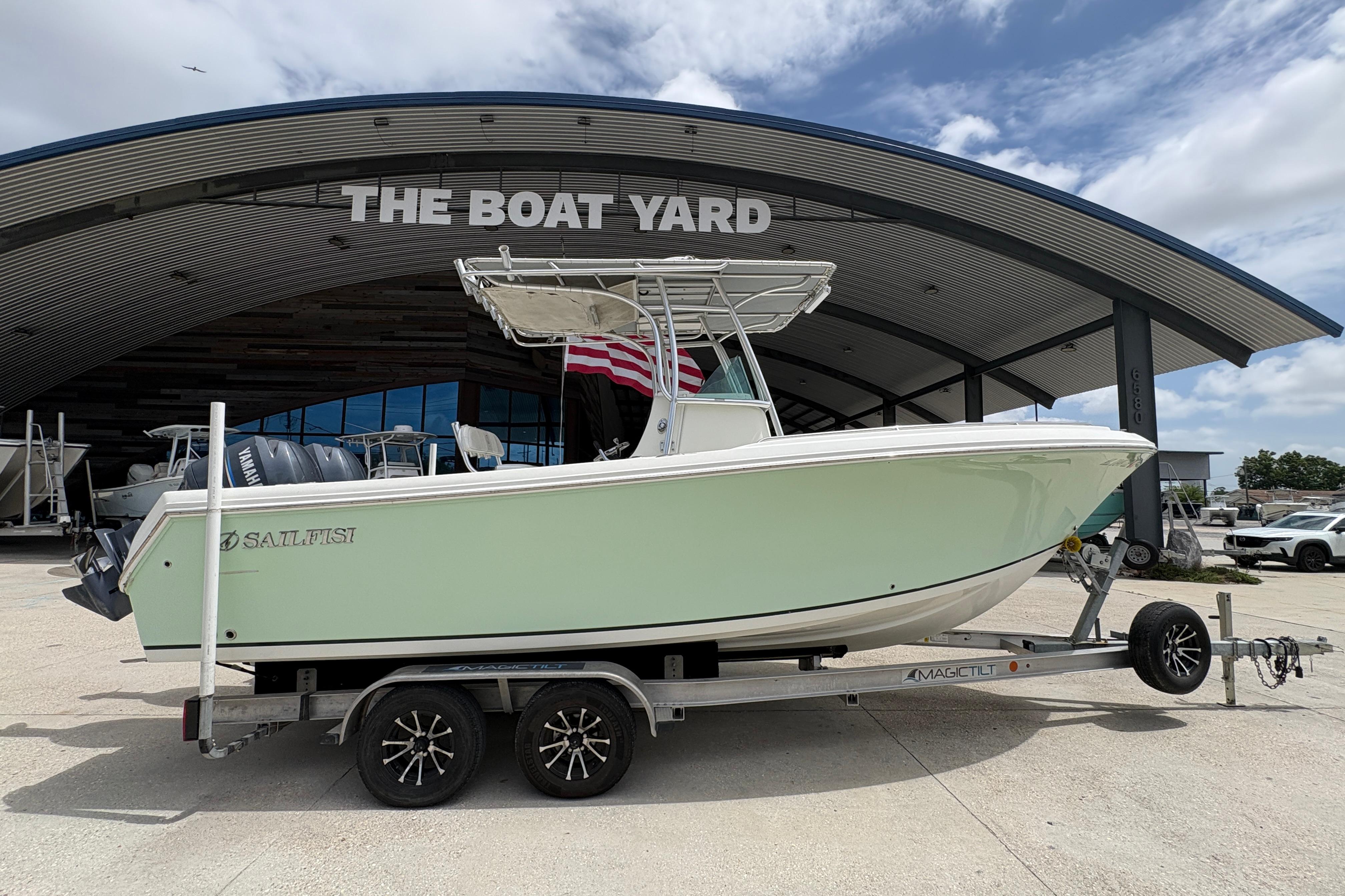 2006 Sailfish 2360 boat on trailer at The Boat Yard dealership.