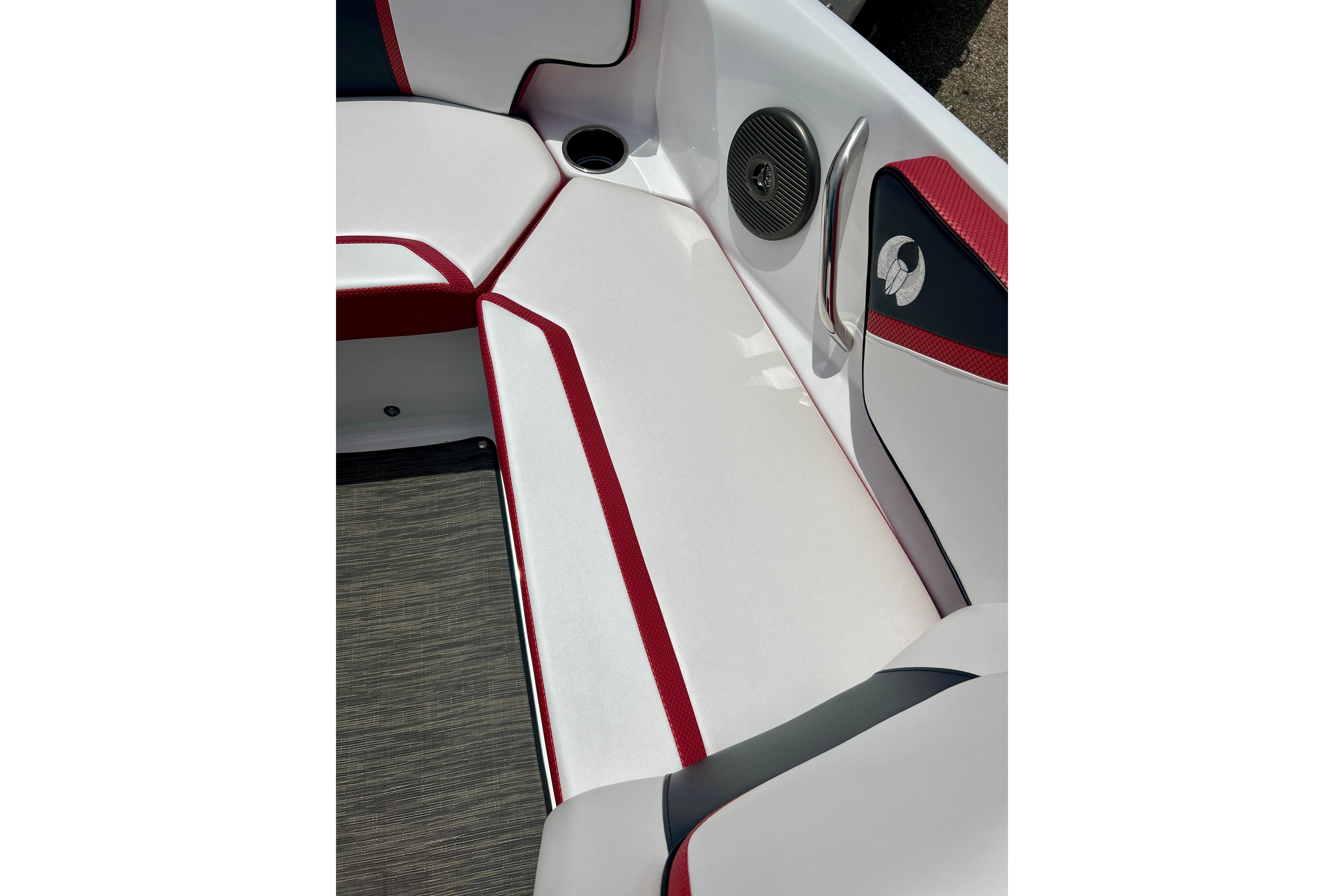 2021 Scarab 195 ID boat interior with red and white seating and speaker detail.