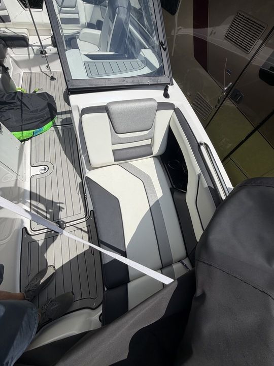 Interior view of a Yamaha 212SD boat with gray and white seating.