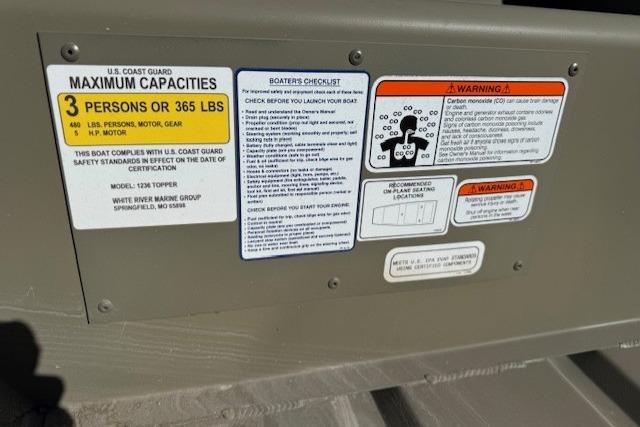 2026 Tracker Grizzly 12 Jon boat capacity and safety warning labels.