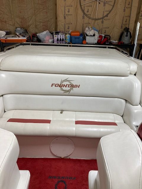 Interior of a 2001 Fountain Lightning boat with white seating.