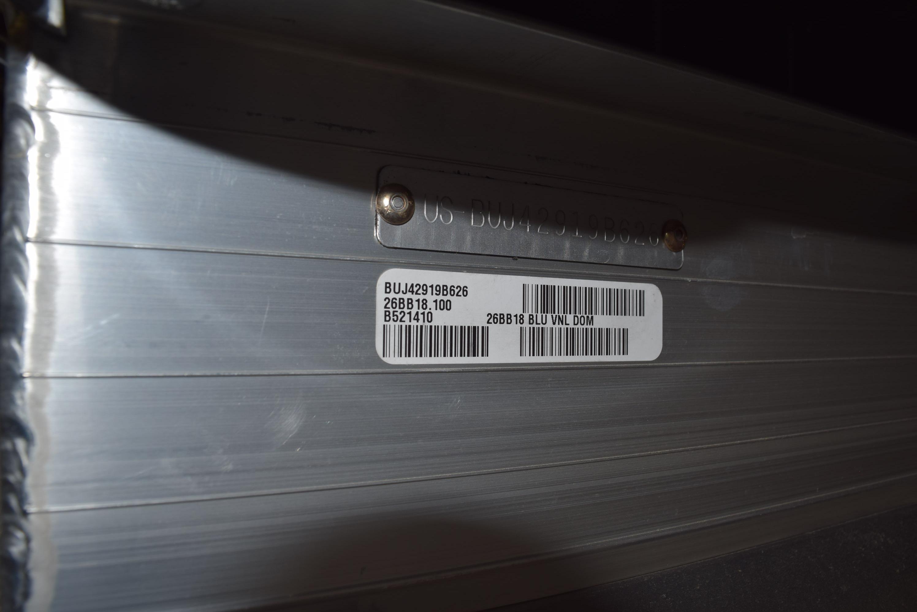 Close-up of a 2026 Sun Tracker Bass Buggy 18 DLX serial number plate.