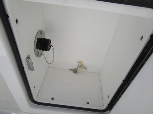 Storage compartment of 2024 Ranger 2660 Bay boat with a fuel cap.