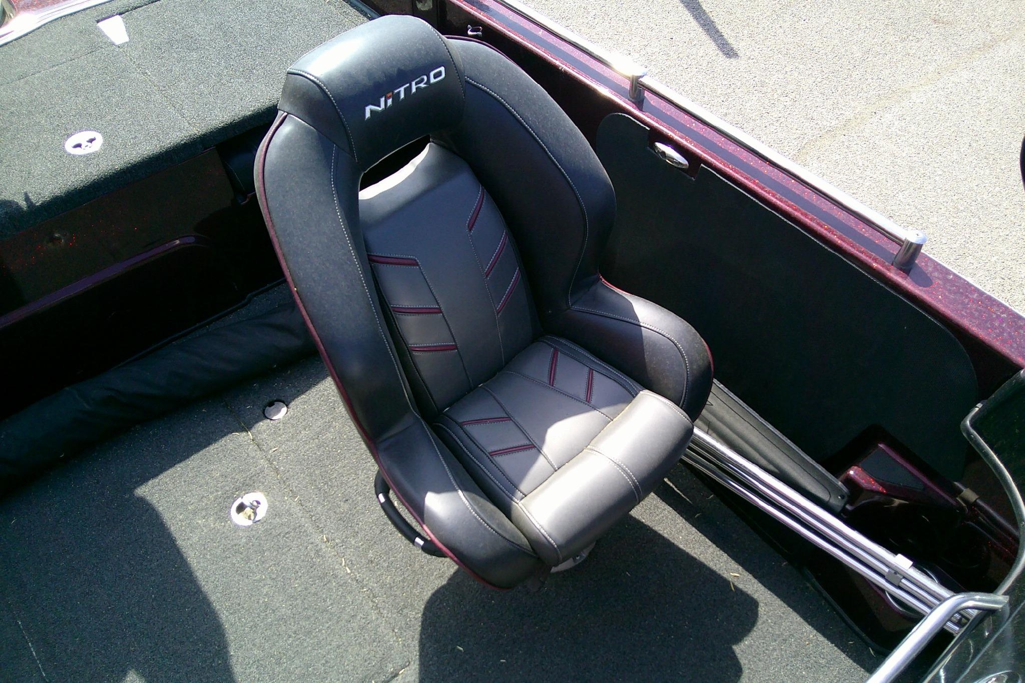 2019 Nitro ZV19 Sport boat seat, black and gray with red accents, on deck.