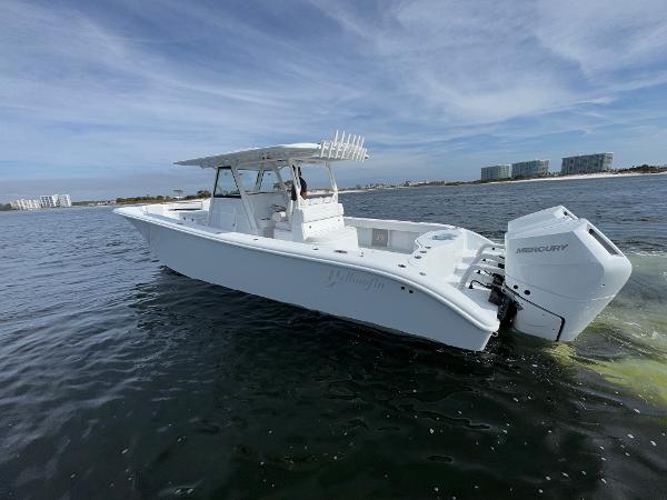 2025 Yellowfin 39 Offshore boat on water with Mercury engines, clear sky background.