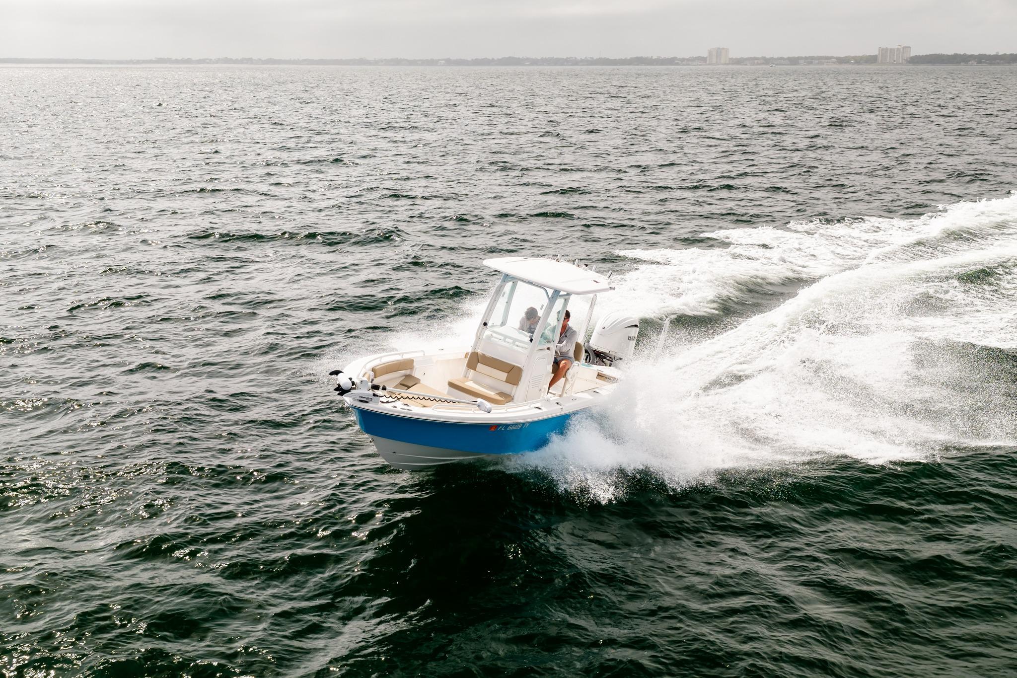 2023 Everglades 243 Center Console boat cruising on open water.