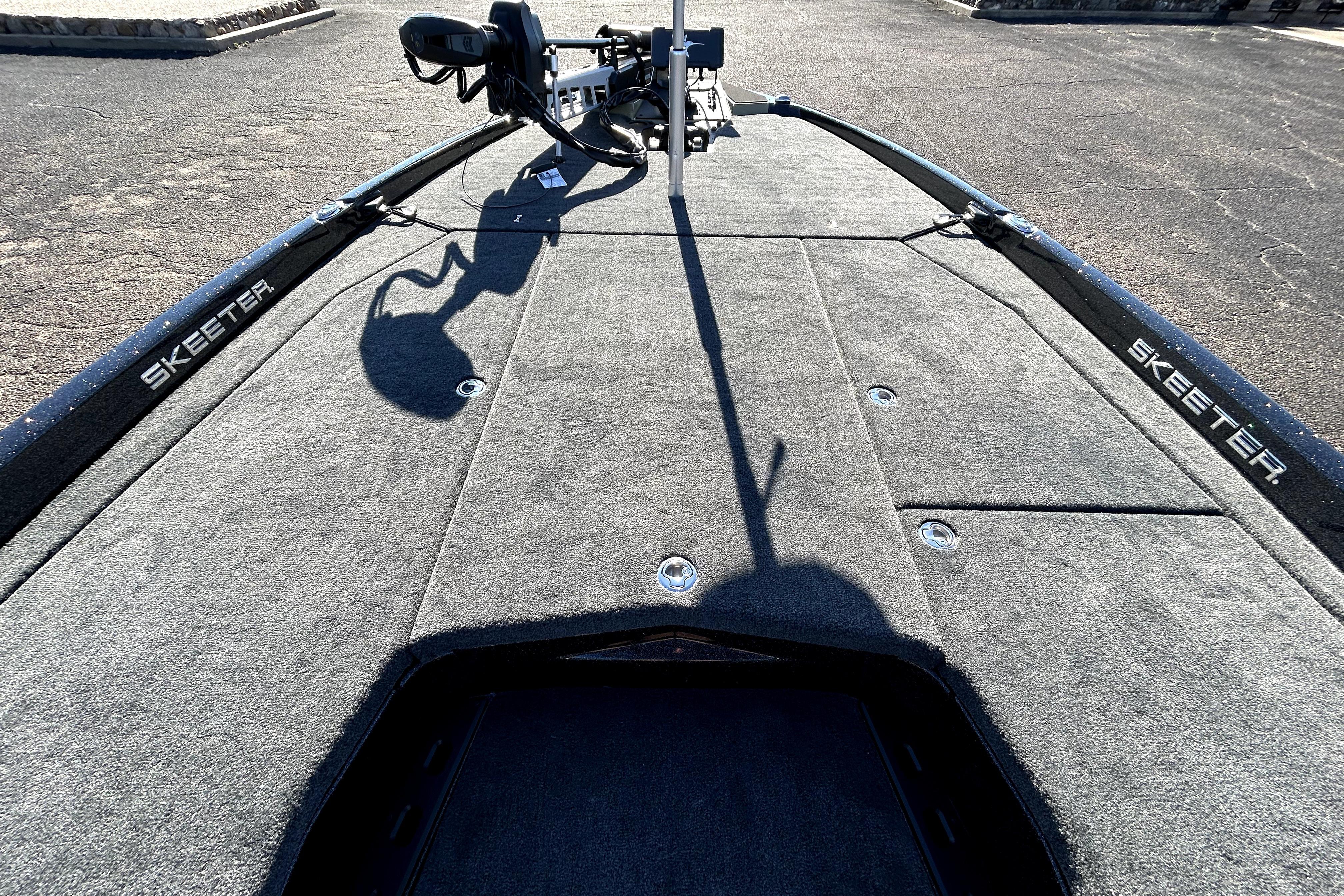 2026 Skeeter ZXE21 boat deck with carpeted surface and storage compartments.