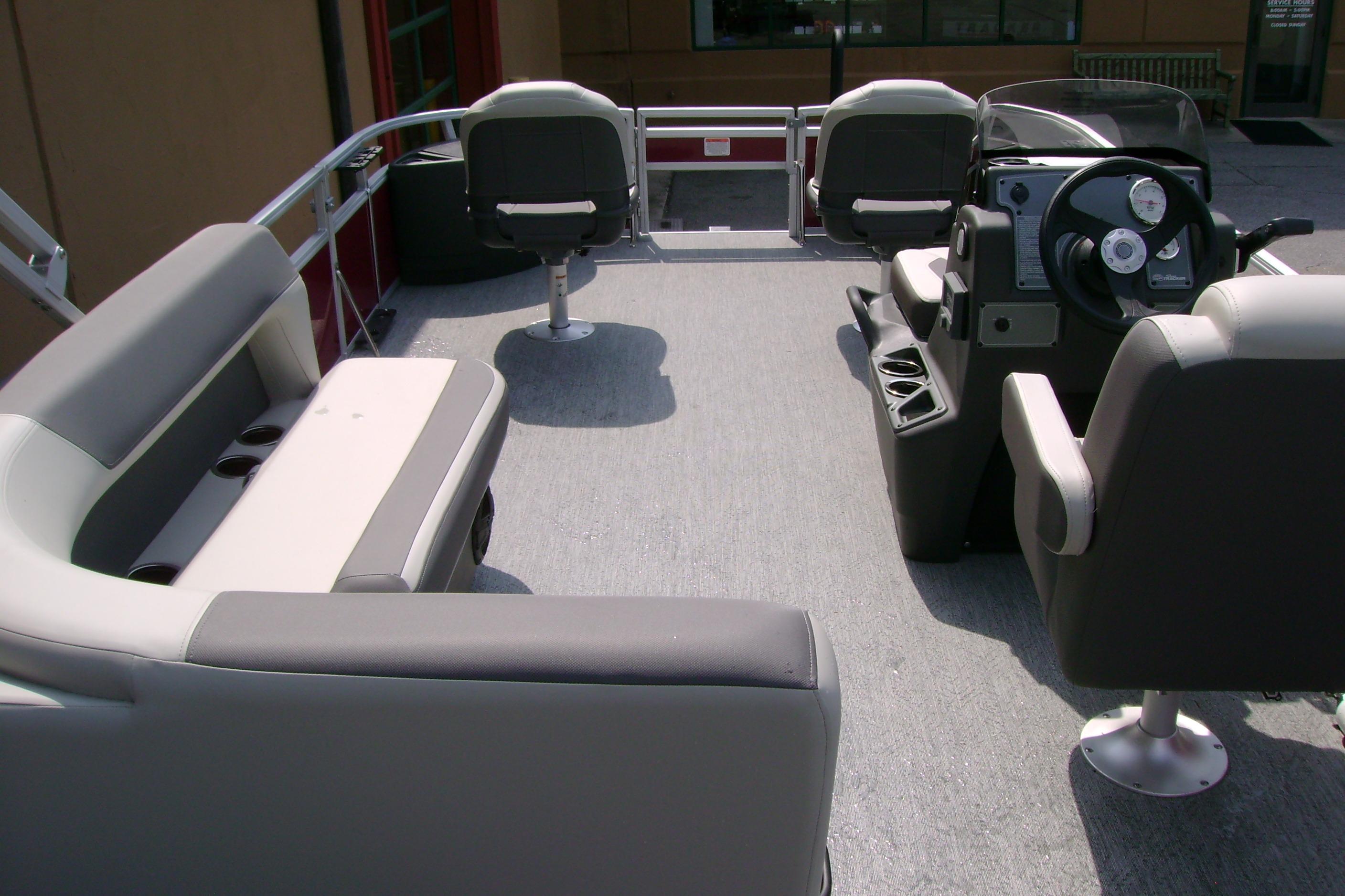 2026 Sun Tracker Bass Buggy 18 DLX interior with seating and steering console.