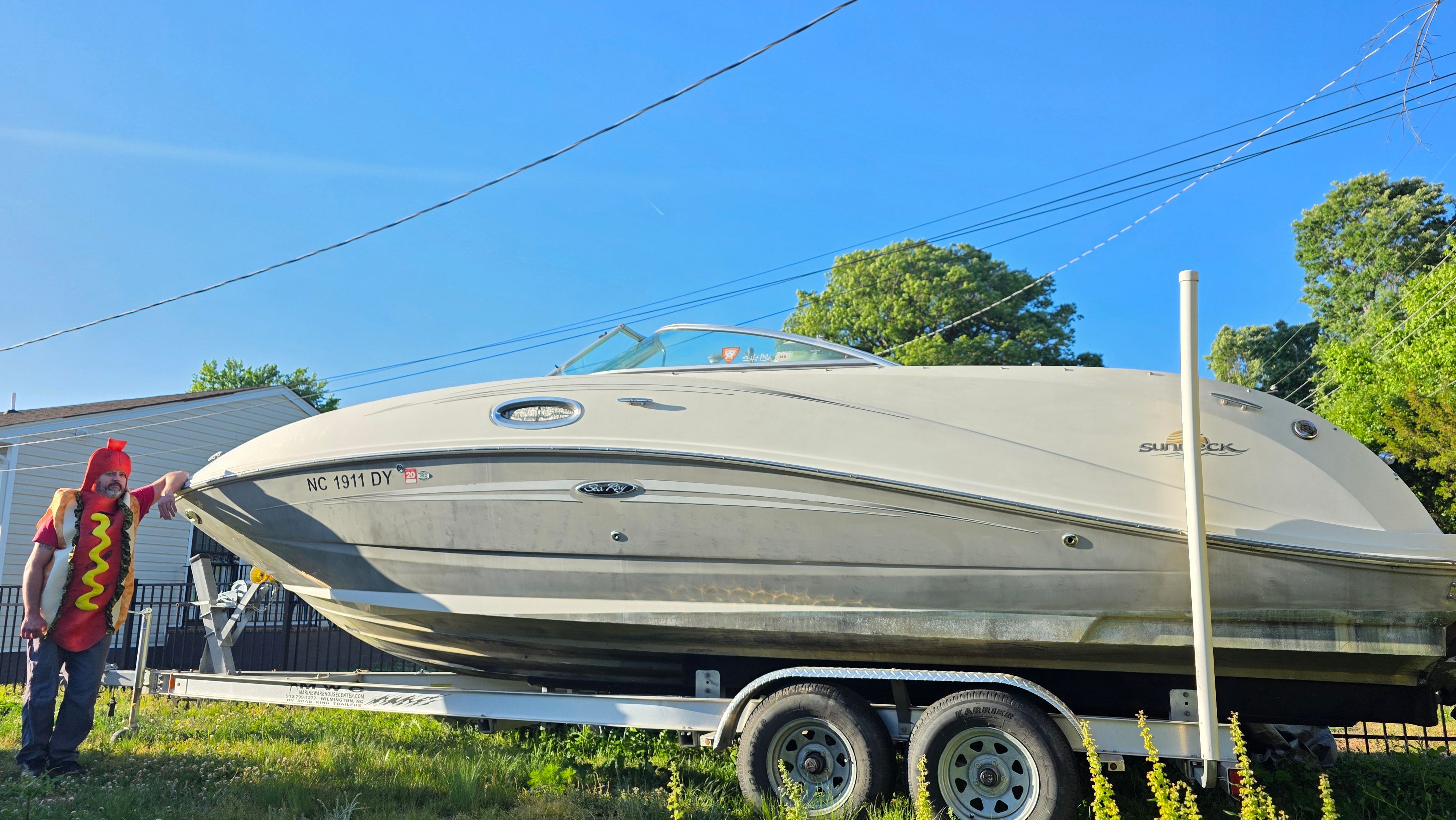 2007 Sea Ray 260 Sundeck on trailer with person in hotdog costume.
