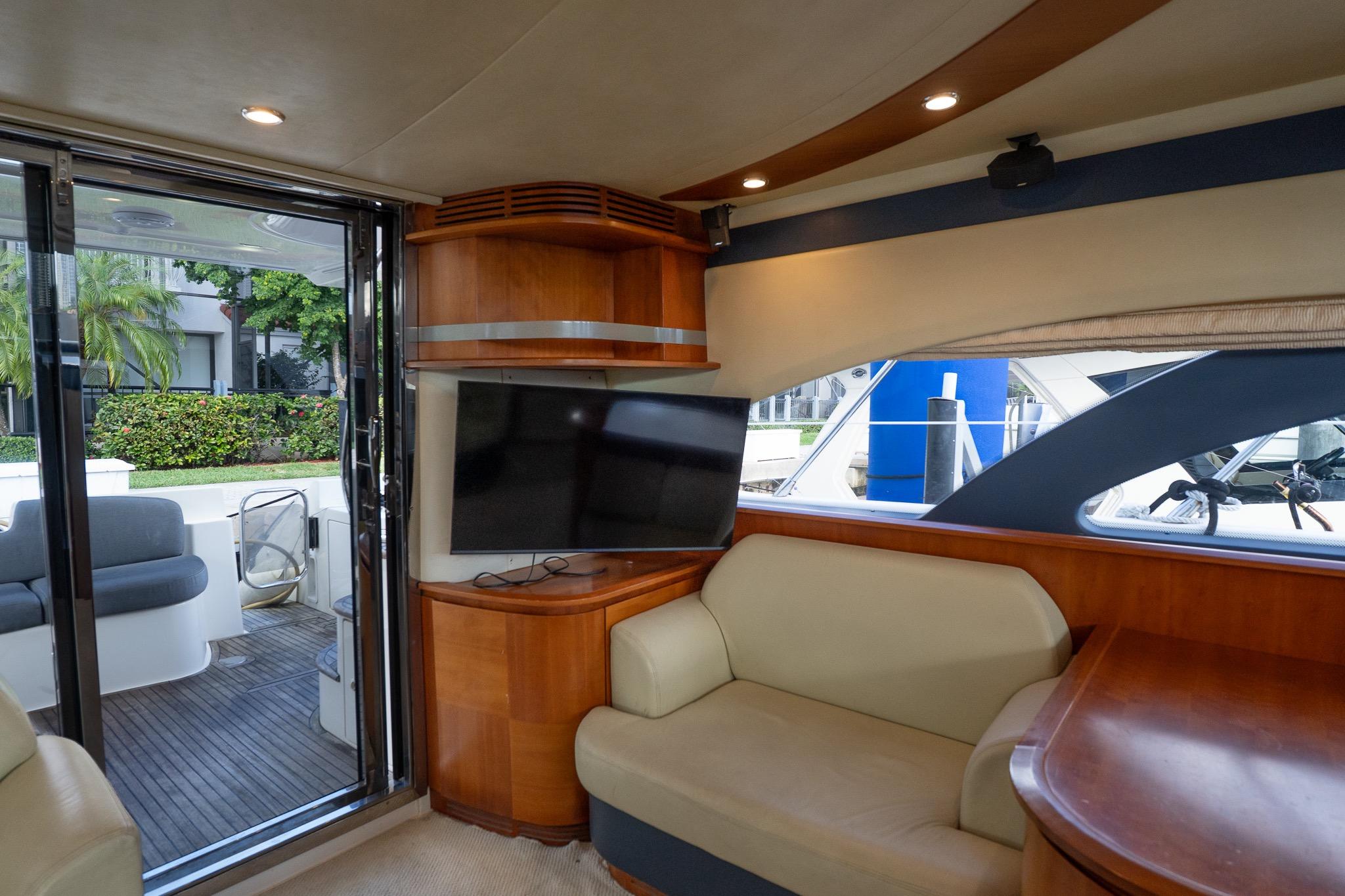 Luxurious interior of 2008 Azimut Fly 50 yacht with modern seating and TV.