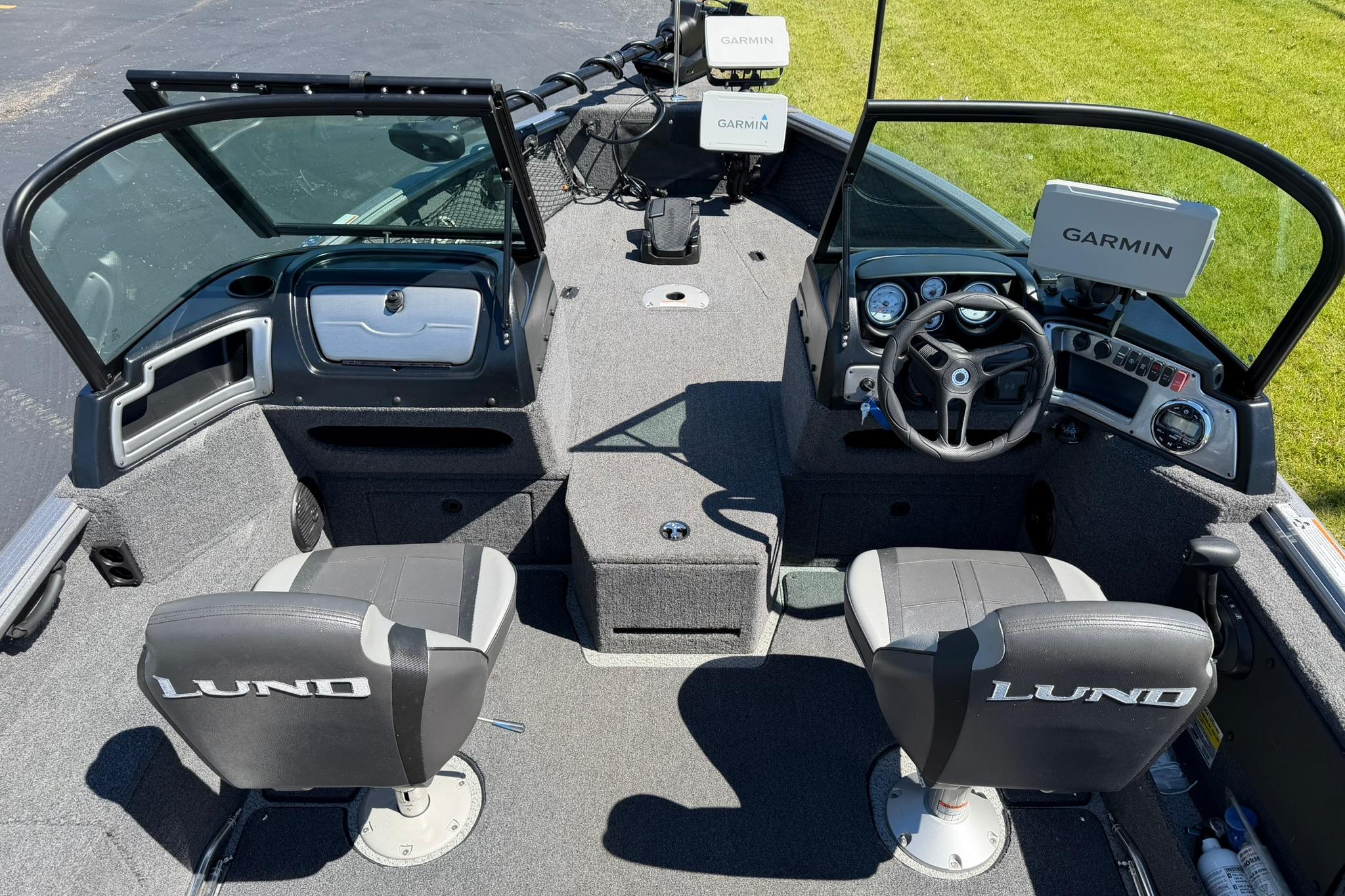 2024 Lund 1875 Impact XS Sport boat interior with Garmin navigation systems.