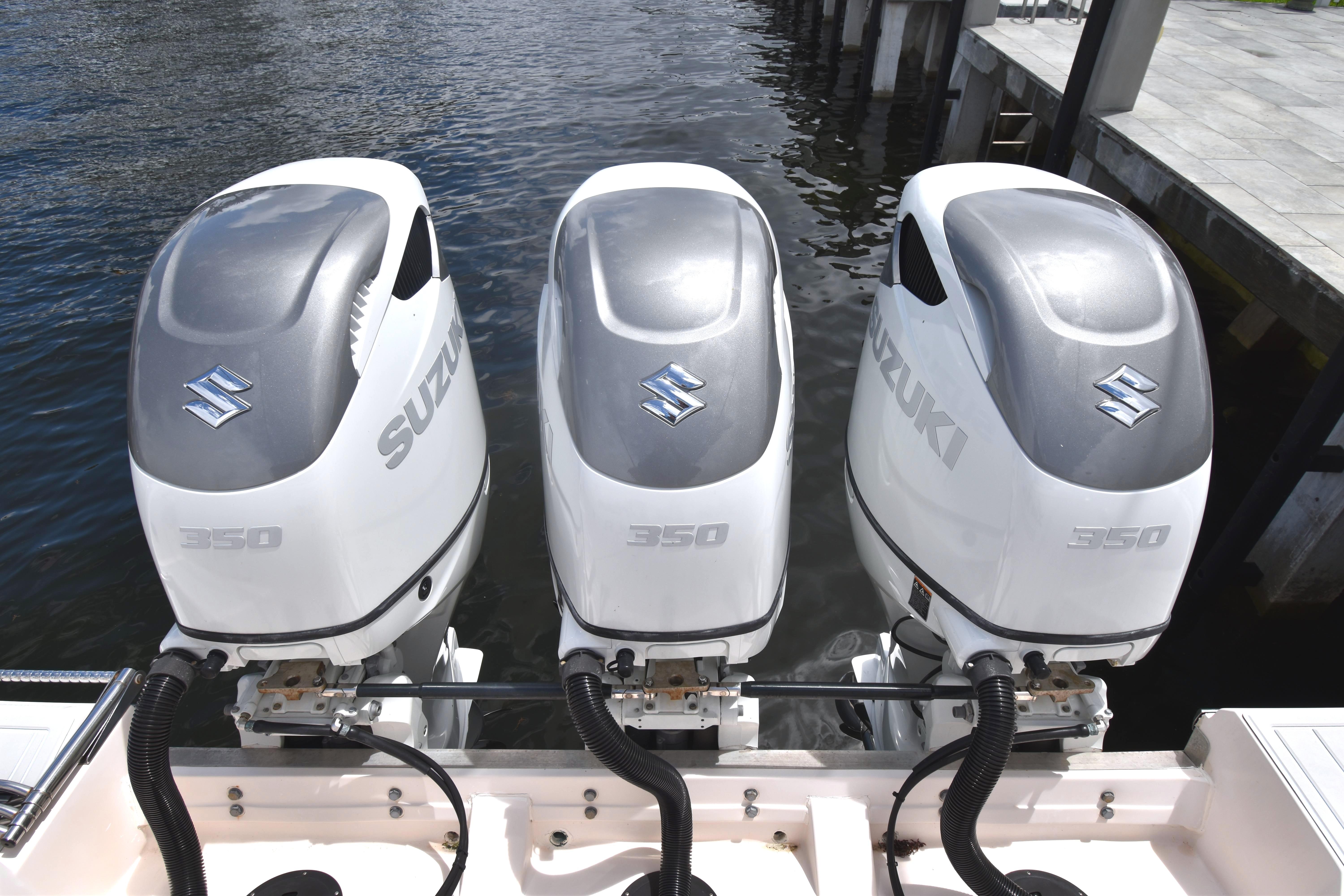 Triple Suzuki 350 outboard engines on a 2010 Grady-White Canyon 366 boat.