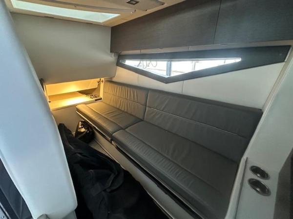 Interior of 2022 Cobalt A36BR boat with sleek gray seating and modern lighting.