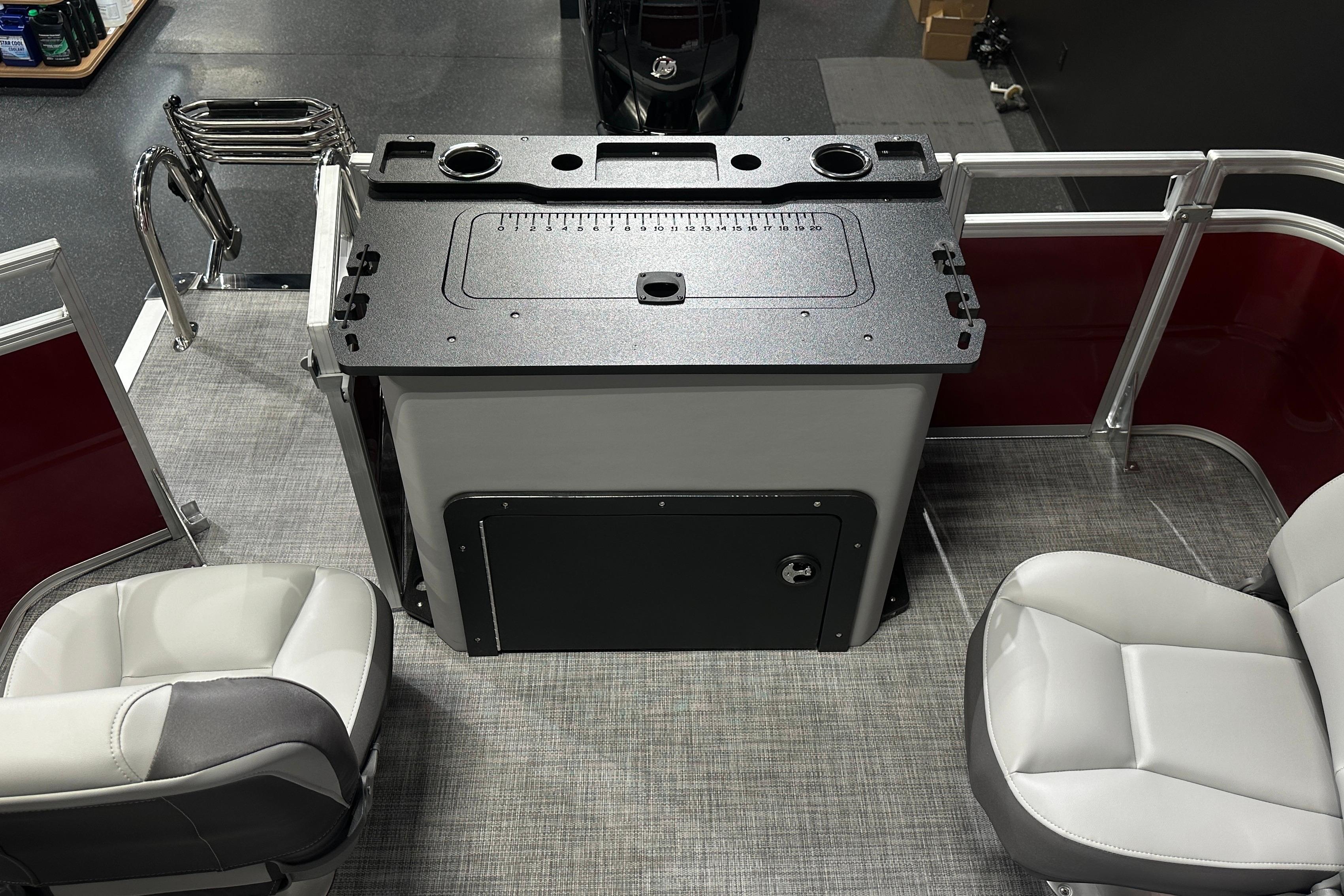 2026 Sun Tracker SportFish 22 DLX interior with seating and storage.