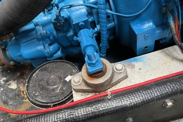 Engine component of a 1982 Lancer 45 Motorsailer, featuring blue machinery and red wiring.