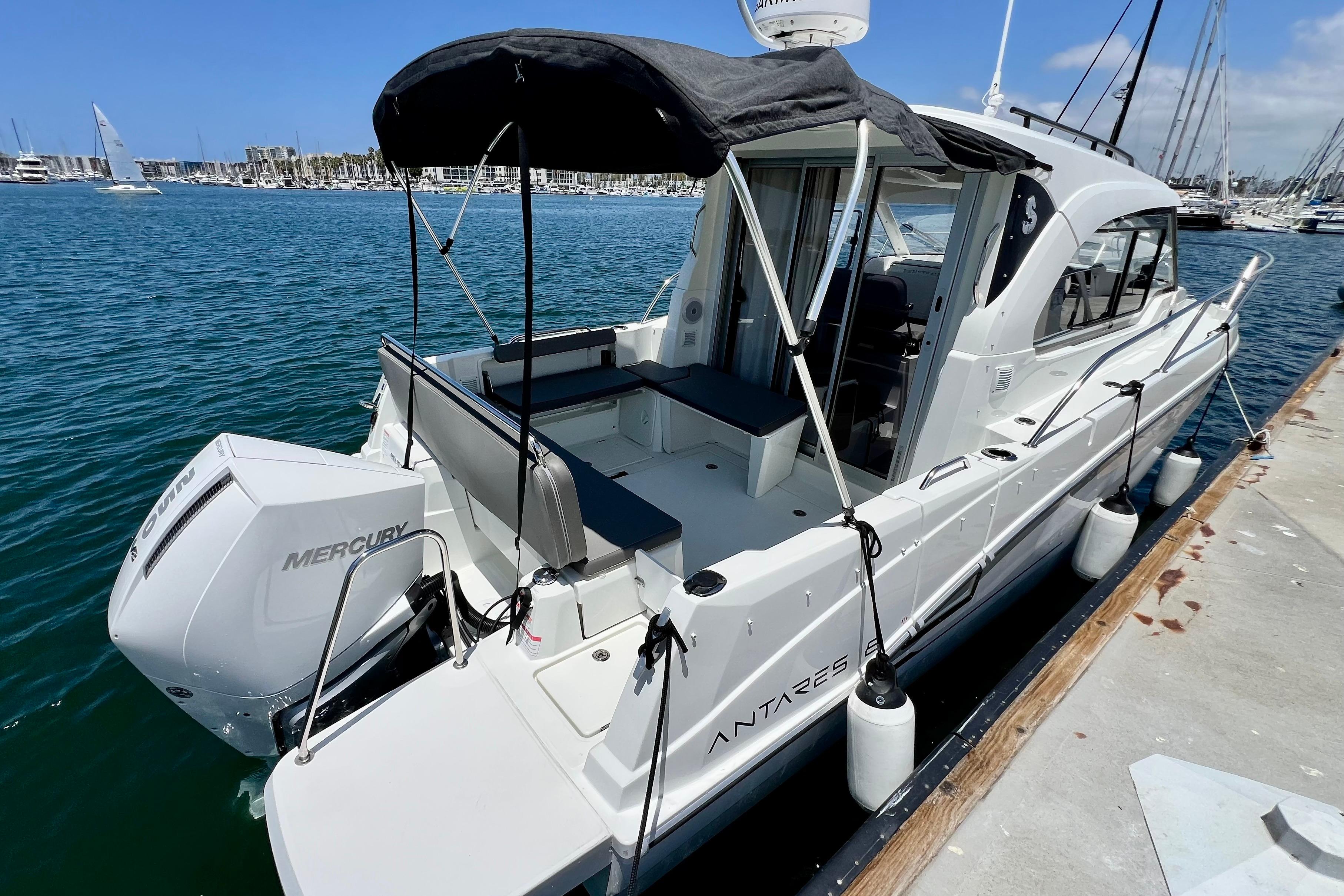 2023 Beneteau Antares 8 boat docked, featuring Mercury engine and sleek design.