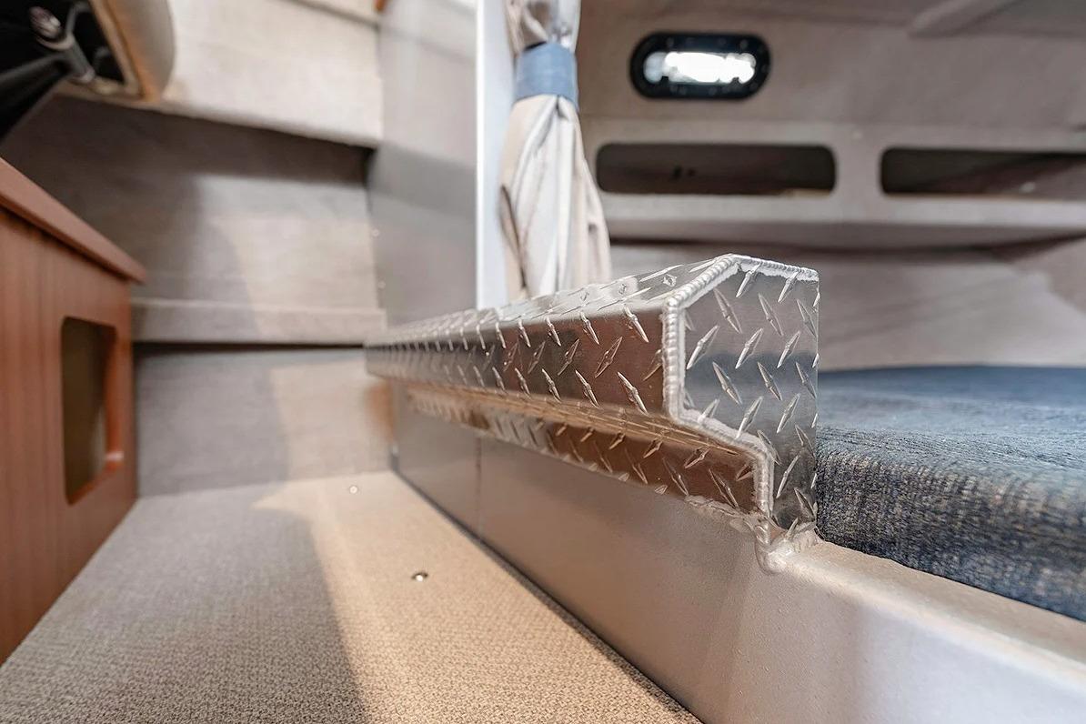 Interior of 2026 KingFisher 3225 GFX Offshore boat, featuring diamond plate detail.