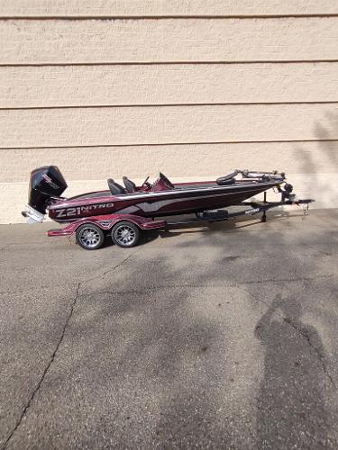 2024 Nitro Z21 XL boat on trailer, parked outdoors.