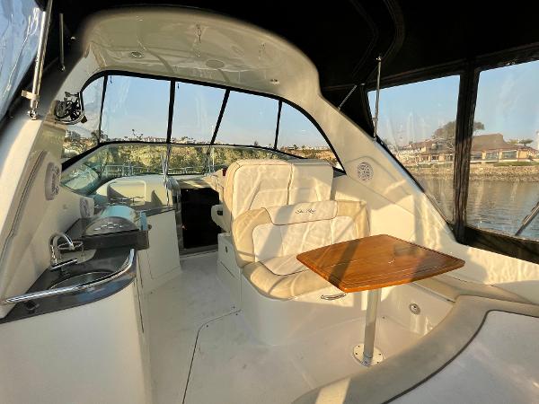 Interior of 2014 Sea Ray 330 Sundancer yacht with seating and table.