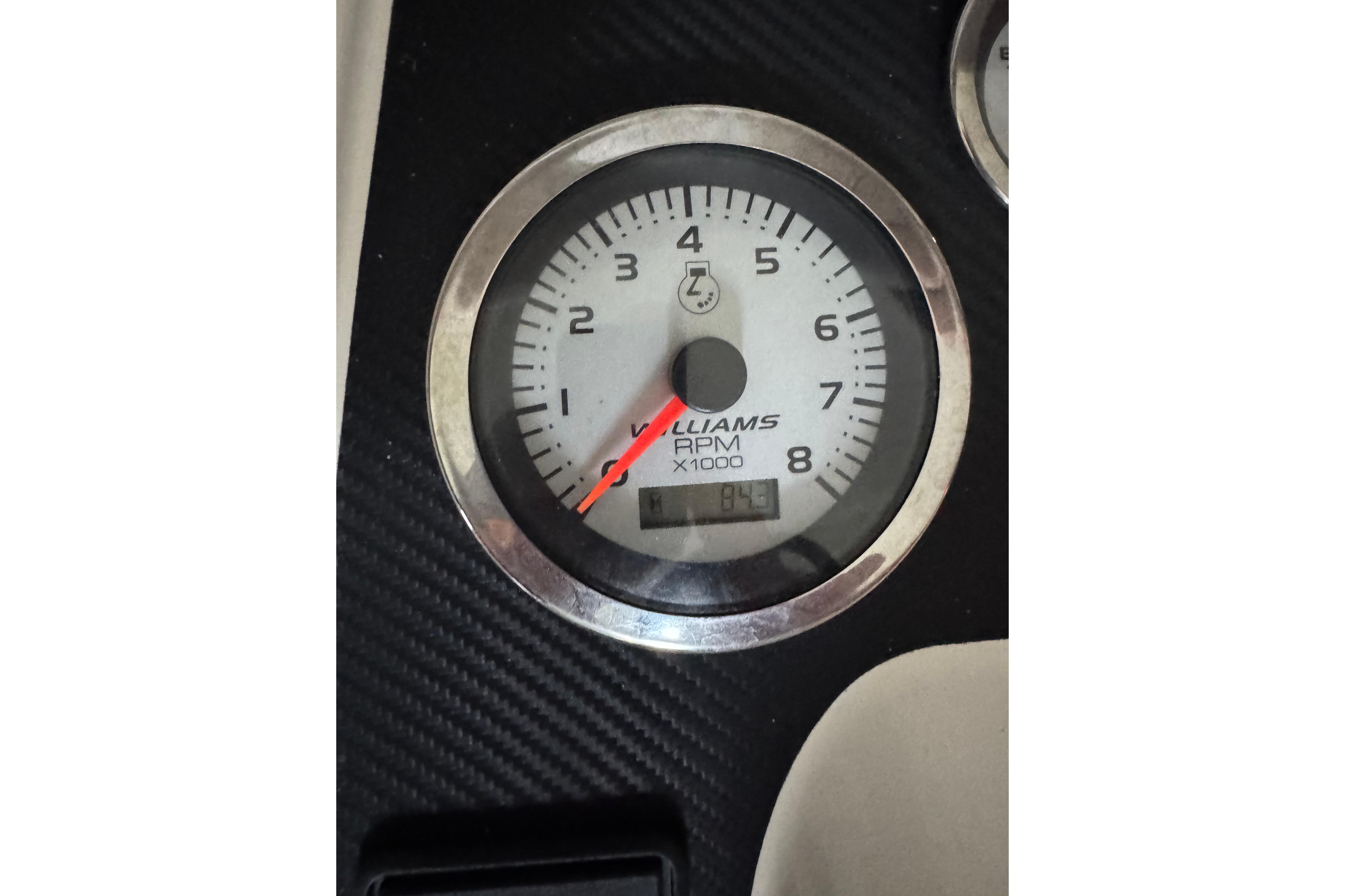 Close-up of Williams Jet Tenders Turbojet 325 tachometer, displaying RPM.