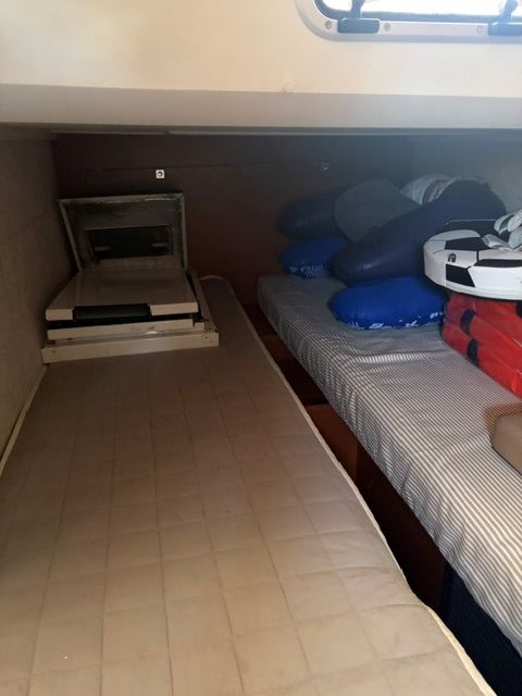 Interior of Jeanneau Leader 36 yacht, sleeping area with mattresses.