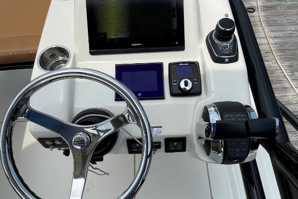 2020 Scout 420 LXF boat dashboard with steering wheel and control panel.
