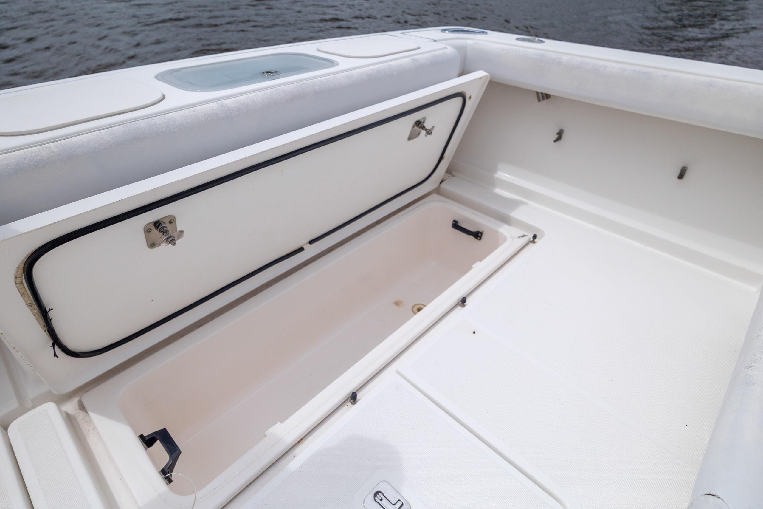 Open storage compartment on 2004 Tiara Yachts 3200 Open boat deck.