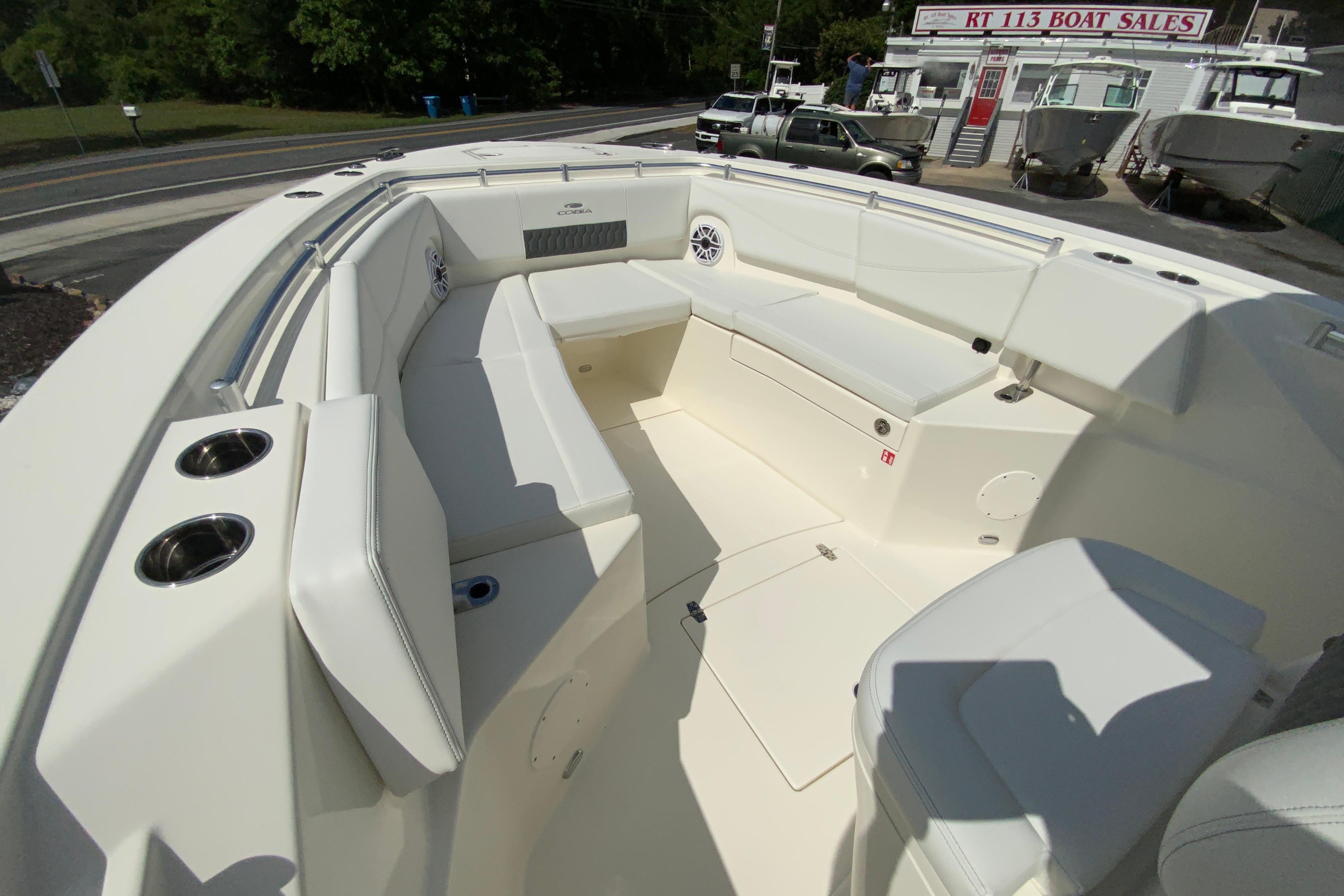 2027 Cobia 320 Center Console boat interior with spacious seating and cup holders.