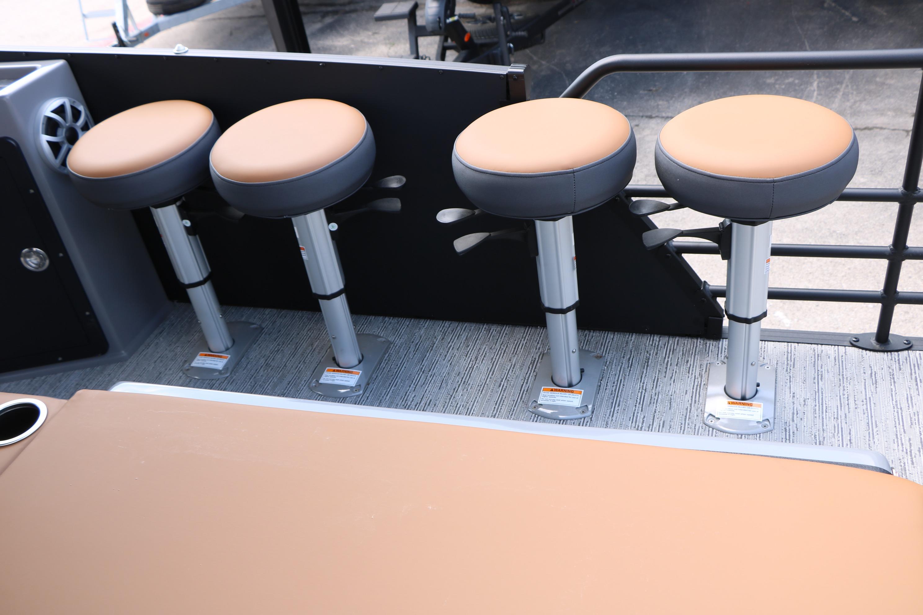 Four bar stools on 2026 Sylvan L3 DLZ Bar Platinum Edition Tri-Toon boat deck.