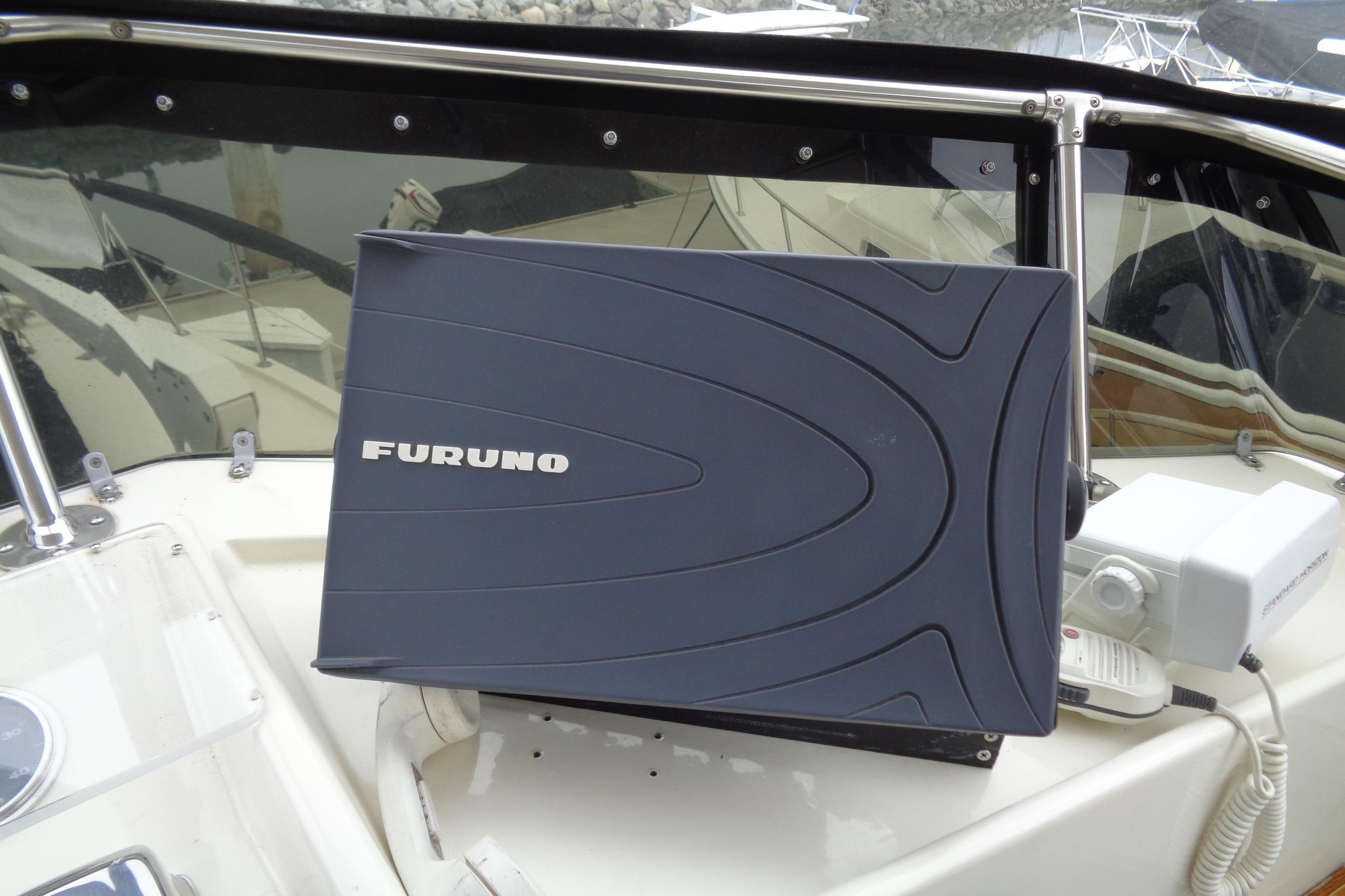 Furuno navigation equipment on 1981 Hatteras 48 Cockpit Motor Yacht dashboard.