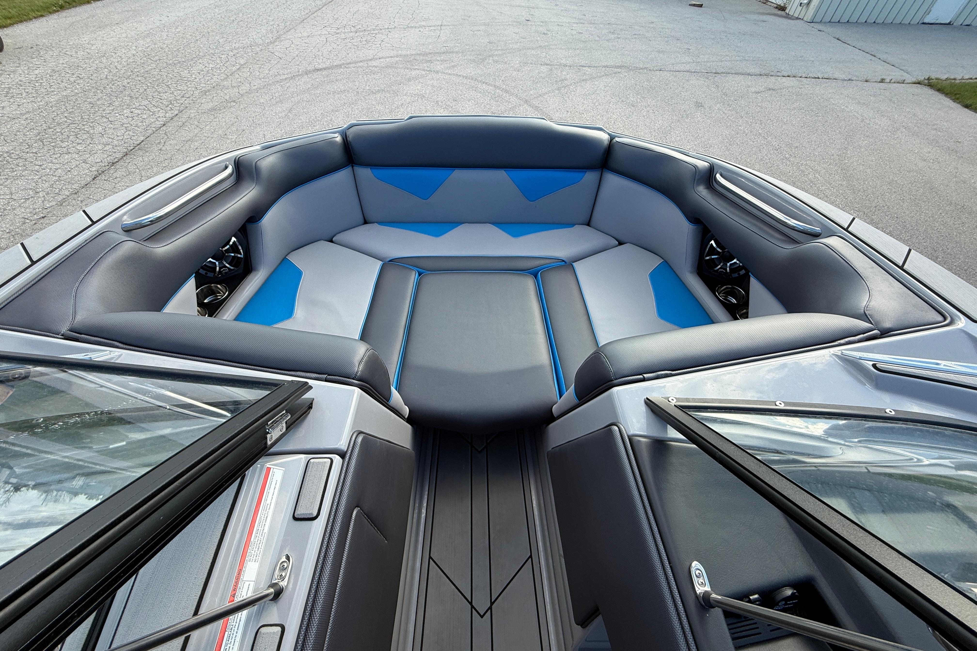 2022 Moomba Kaiyen boat interior with blue and gray seating, showcasing modern design.
