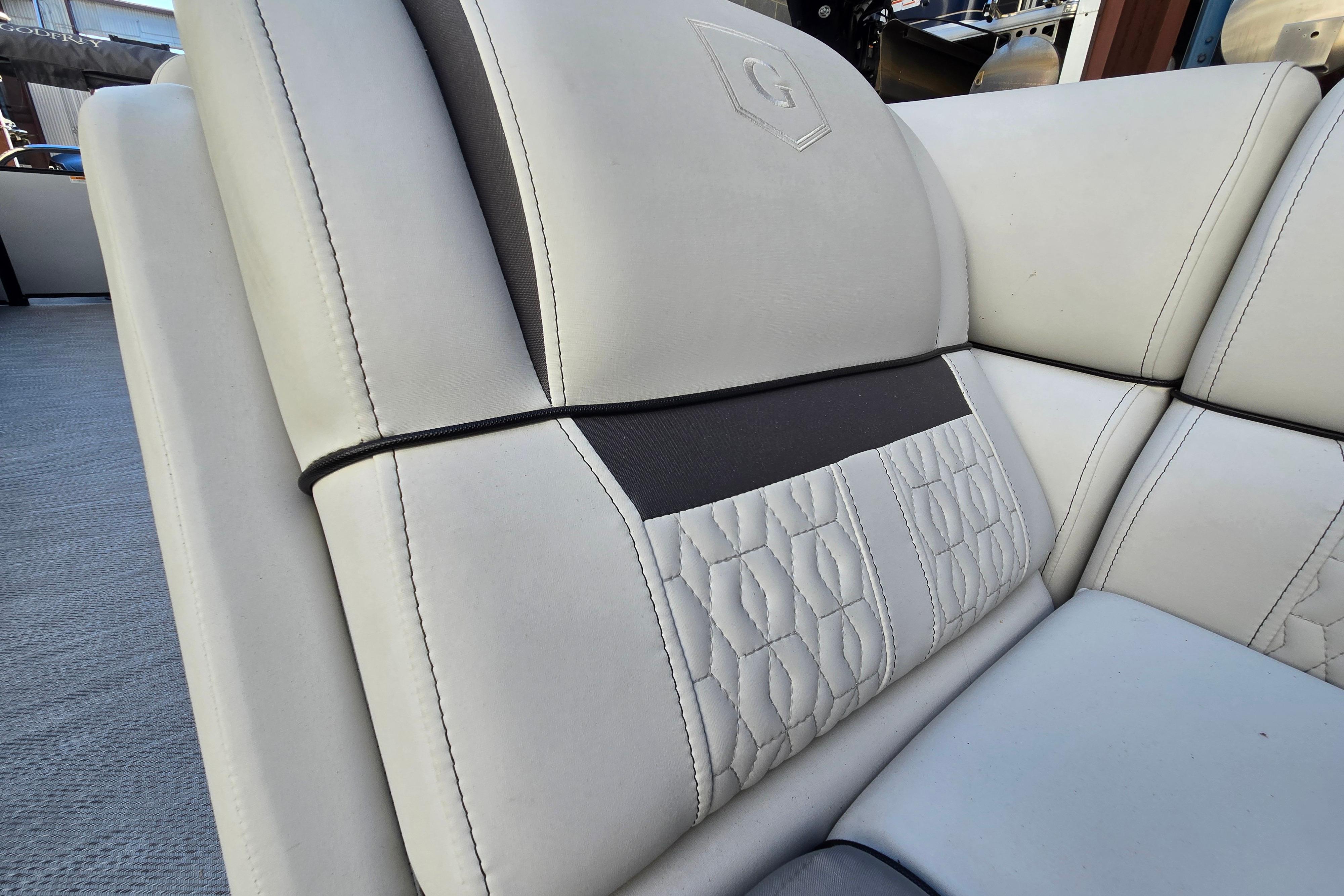 2024 Godfrey Sweetwater 2486 SB boat seat with elegant stitching and logo detail.