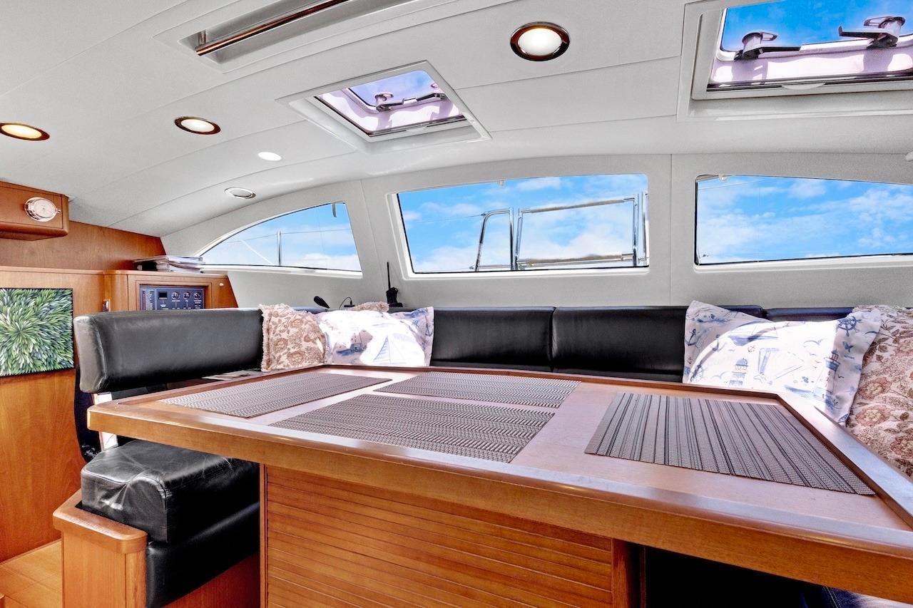 Luxurious interior of 2011 Southerly 57 RS yacht with elegant seating and skylights.