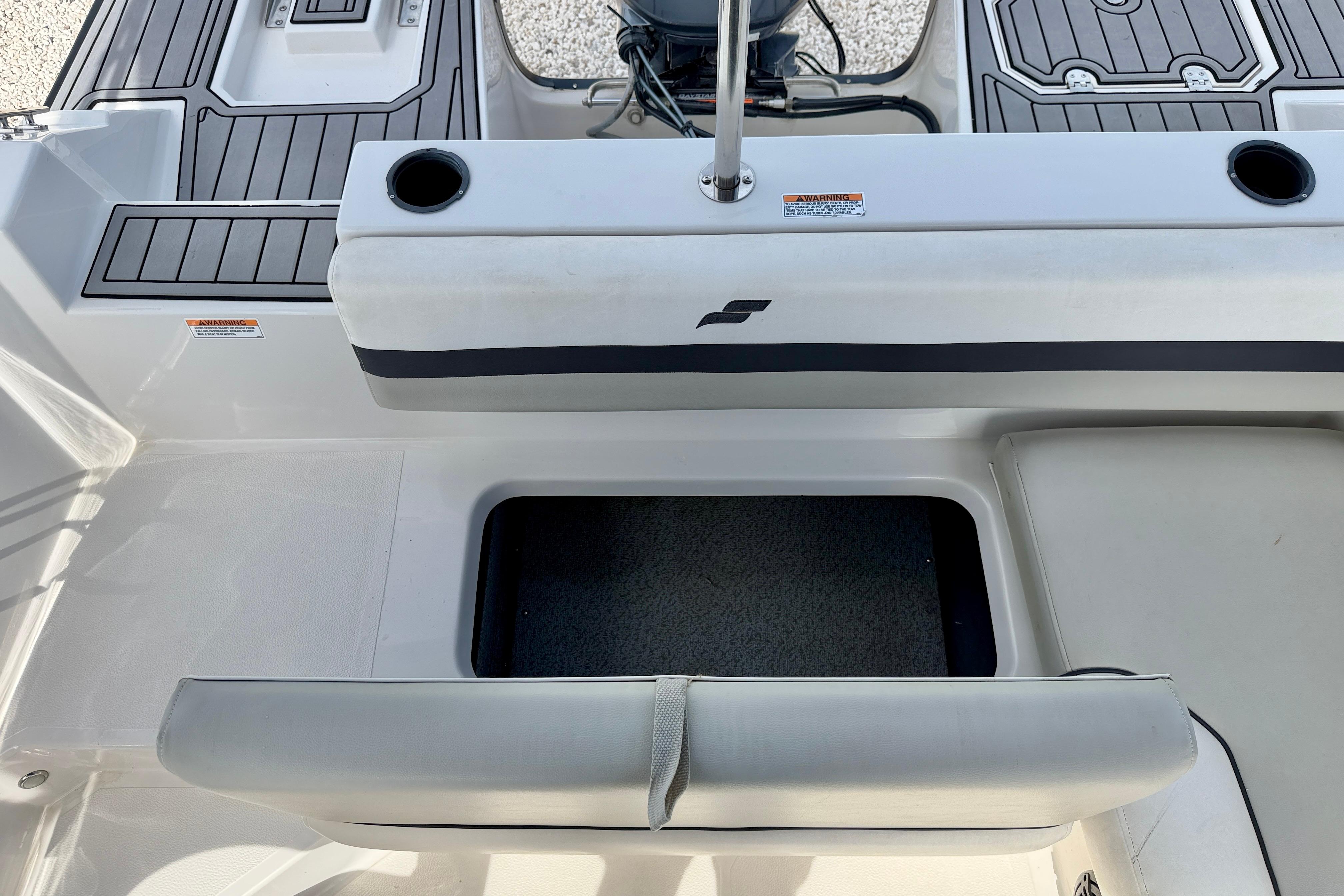 2021 Starcraft SVX 191 OB boat interior with seating and storage compartment.