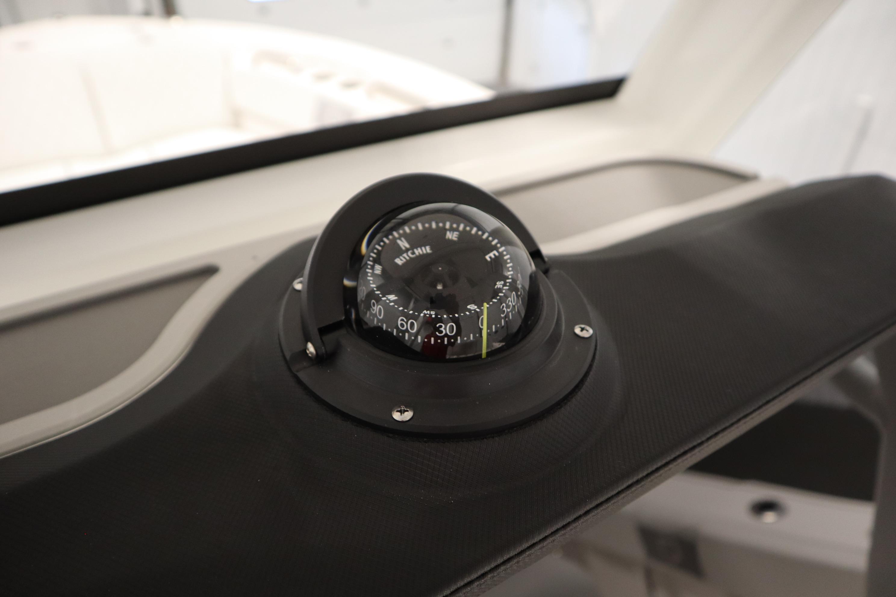Compass on 2026 Sea Fox 228 Commander boat dashboard, close-up view.