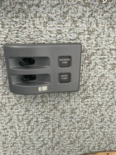 Control panel of 2025 Spartan 2600 Olympia with macerator and water pump switches.