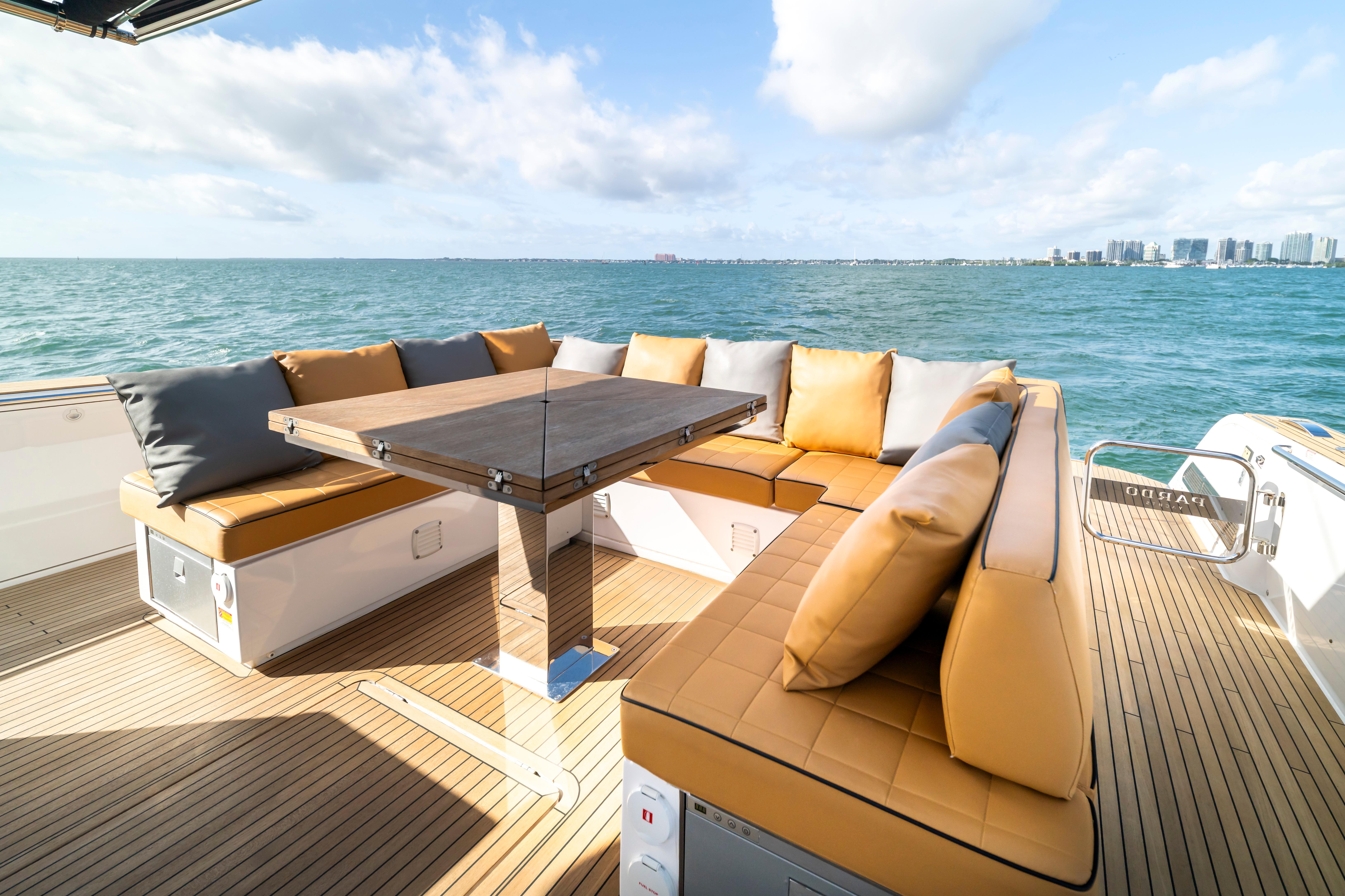 Luxurious seating area on 2023 Pardo Yachts 50, overlooking serene ocean view.