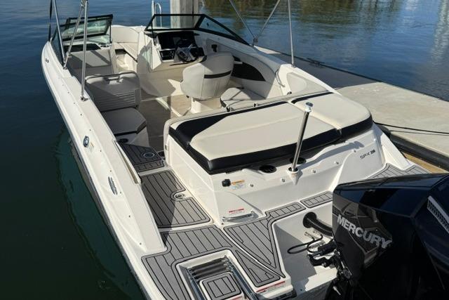 2022 Sea Ray SPX 210 Outboard boat docked, featuring spacious seating and Mercury engine.
