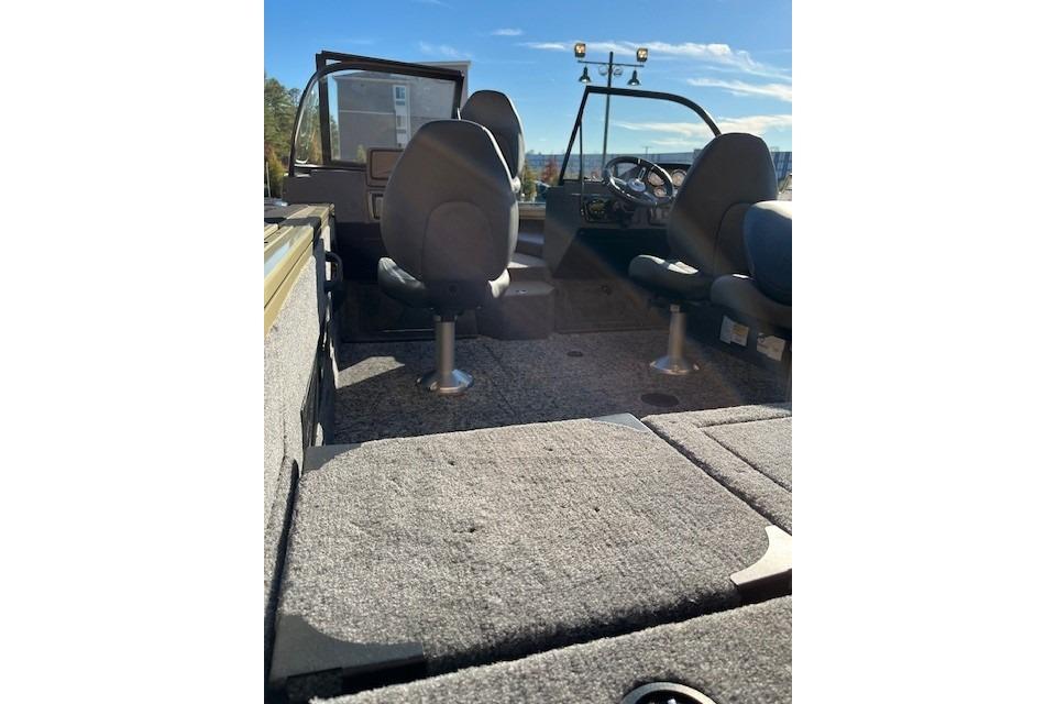 Interior of 2026 Tracker Targa V-18 Combo boat with seating and steering wheel.