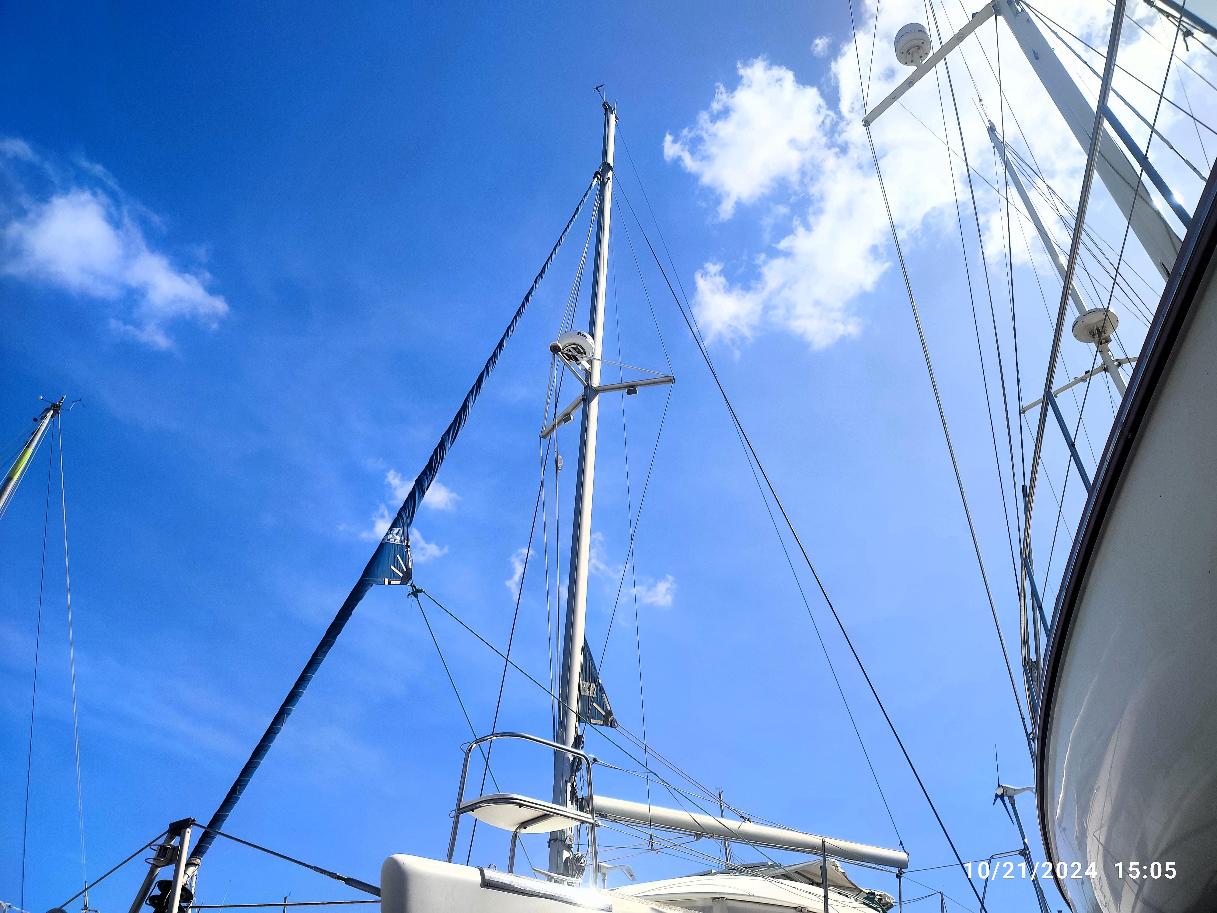 Lagoon 380 catamaran mast against a clear blue sky, 2001 model.